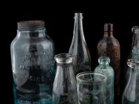 Sixteen Glass Advertising Bottles