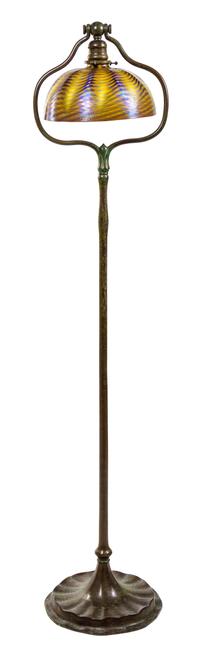 A Tiffany Favrile Glass and Bronze Floor Lamp Height 55 1/2 x diameter of shade 10 inches.