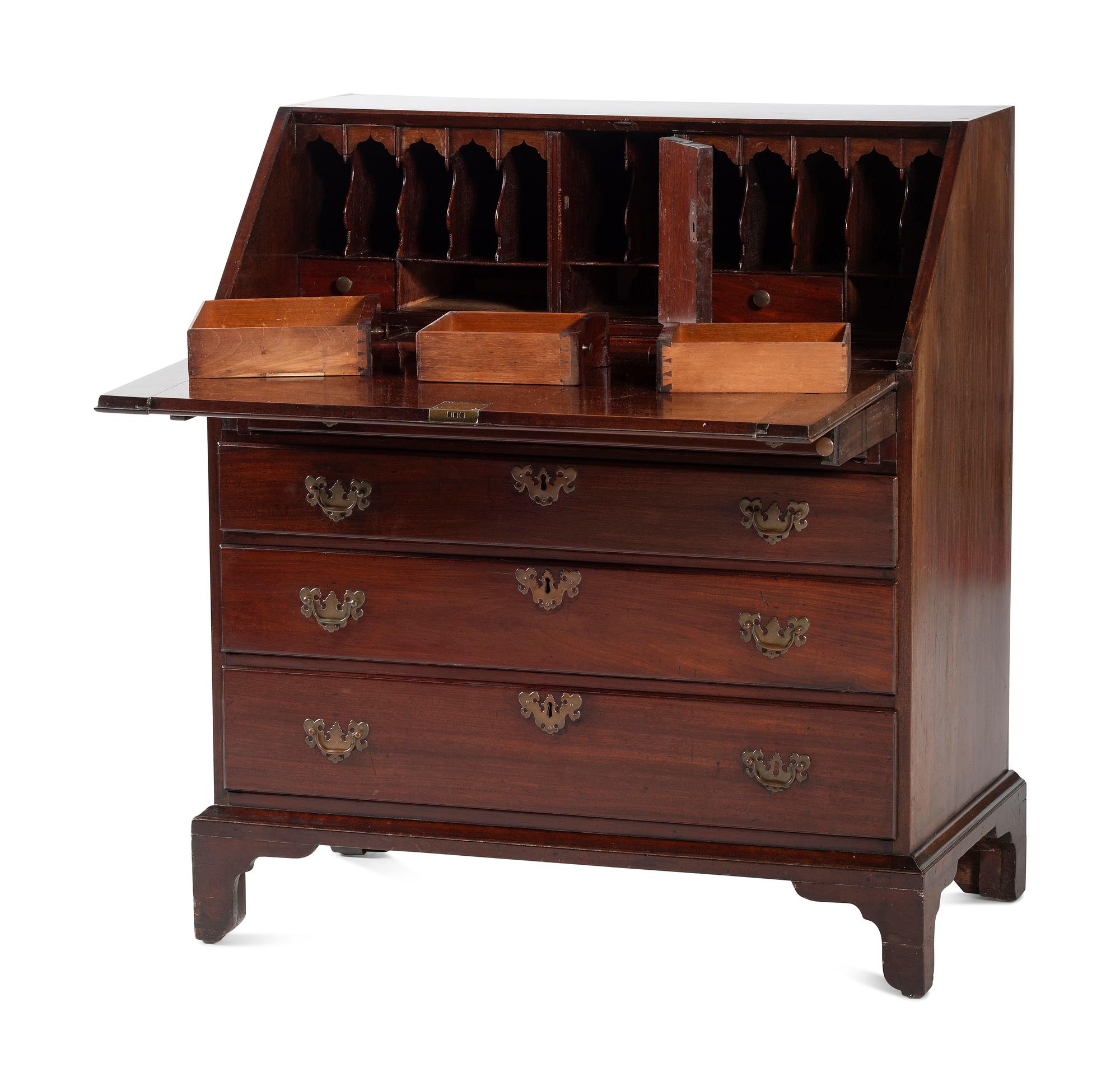 A Chippendale Figured and Shell-Carved Mahogany Slant Front Desk