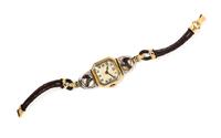 An 18 Karat Yellow Gold, Platinum and Horse Motif Essex Crystal Wristwatch, Henry Blank & Co. for C.H. Meylan,