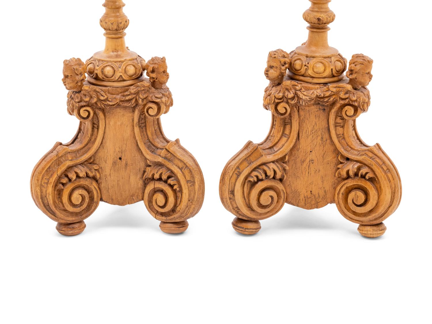 A Pair of Continental Carved Wood Prickets