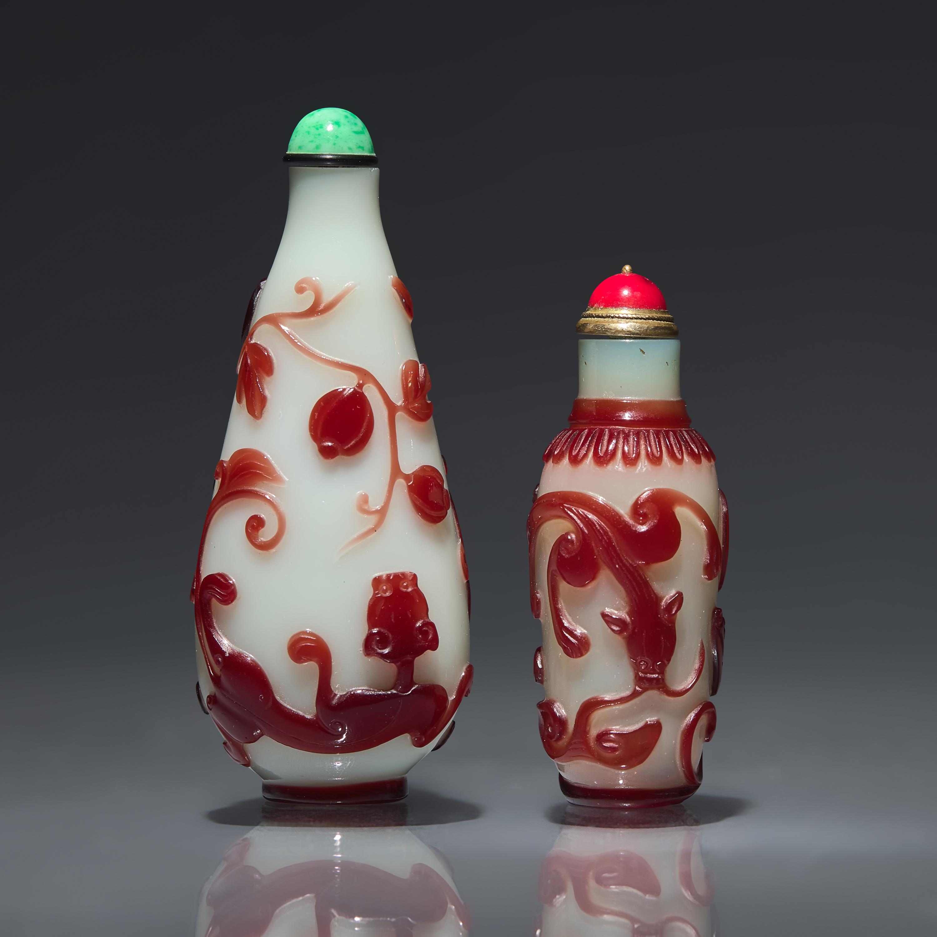 Two Chinese Ruby-Overlay Glass Bottles, Qing dynasty, Circa 1770-1880 — 1770-1880年 白地套寶石紅料螭龍紋鼻煙壺兩支
