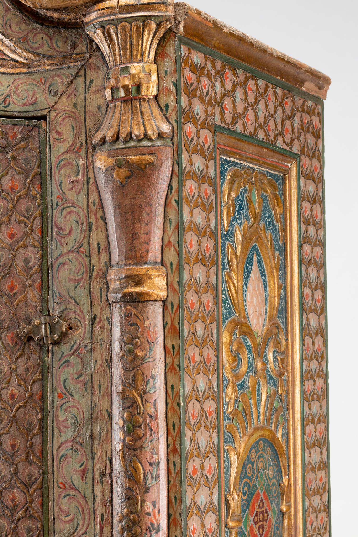 A Continental Painted and Parcel Gilt Cabinet