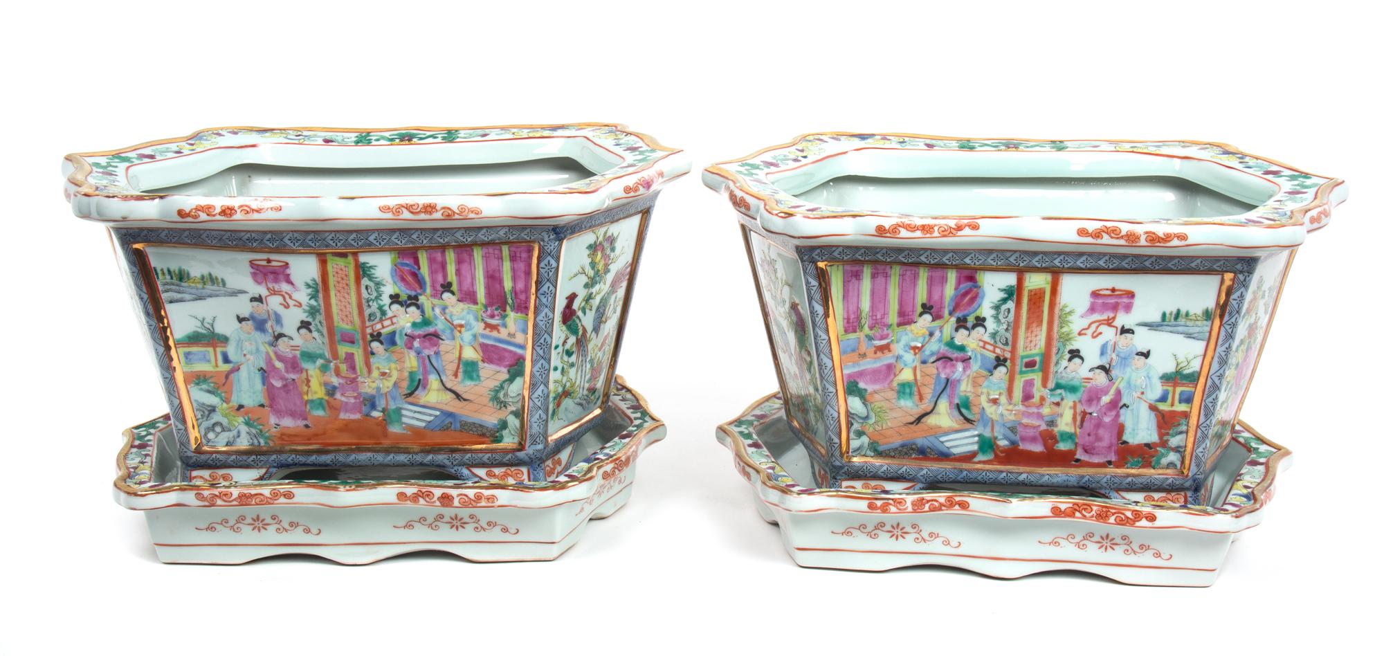 A Pair of Chinese Rose Mandarin Style Porcelain Jardinieres Height 9 3/4 inches; length of undertray 15 inches. — 20TH CENTURY