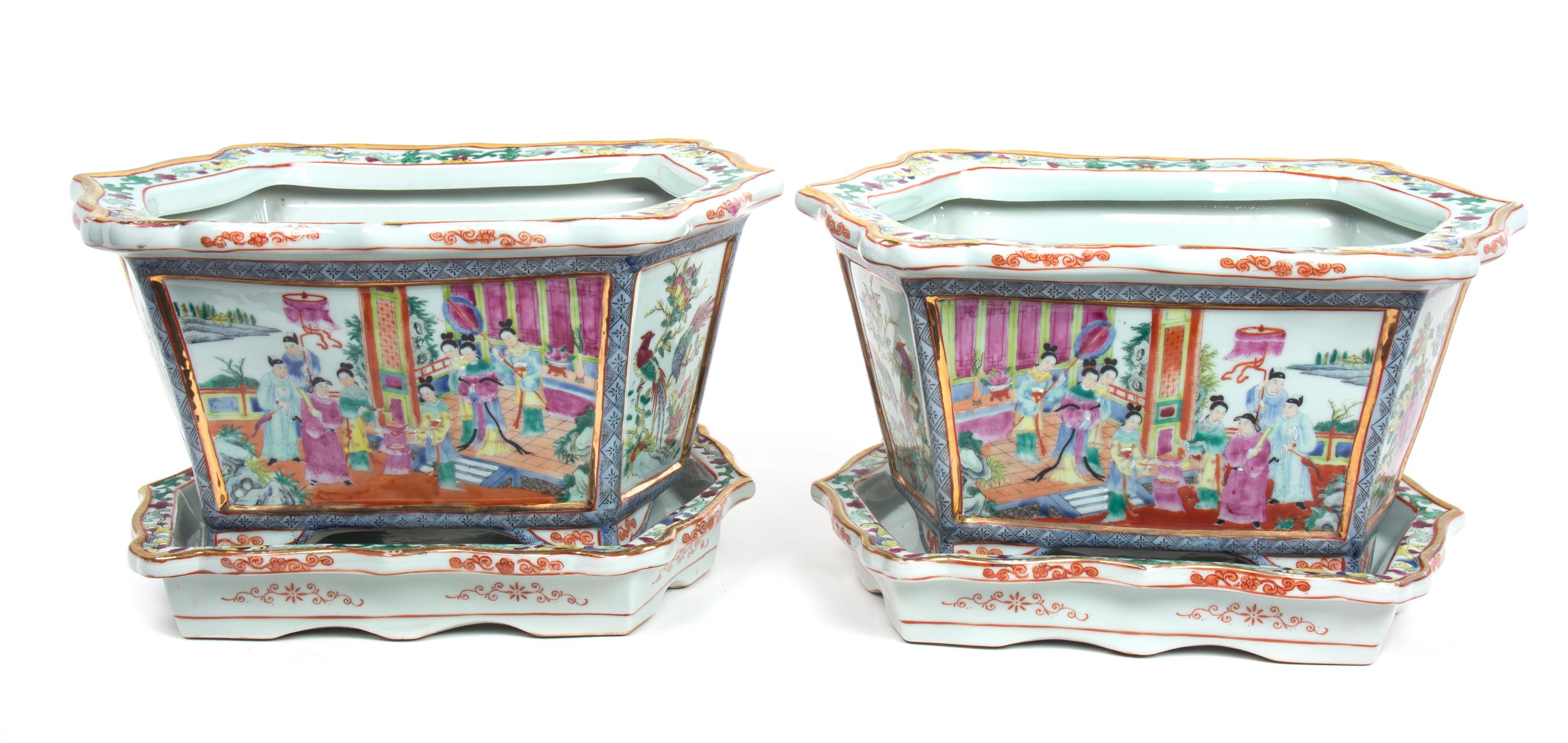 A Pair of Chinese Rose Mandarin Style Porcelain Jardinieres Height 9 3/4 inches; length of undertray 15 inches. — 20TH CENTURY