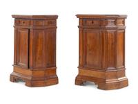 A Pair of North Italian Carved and Paneled Walnut Cabinets