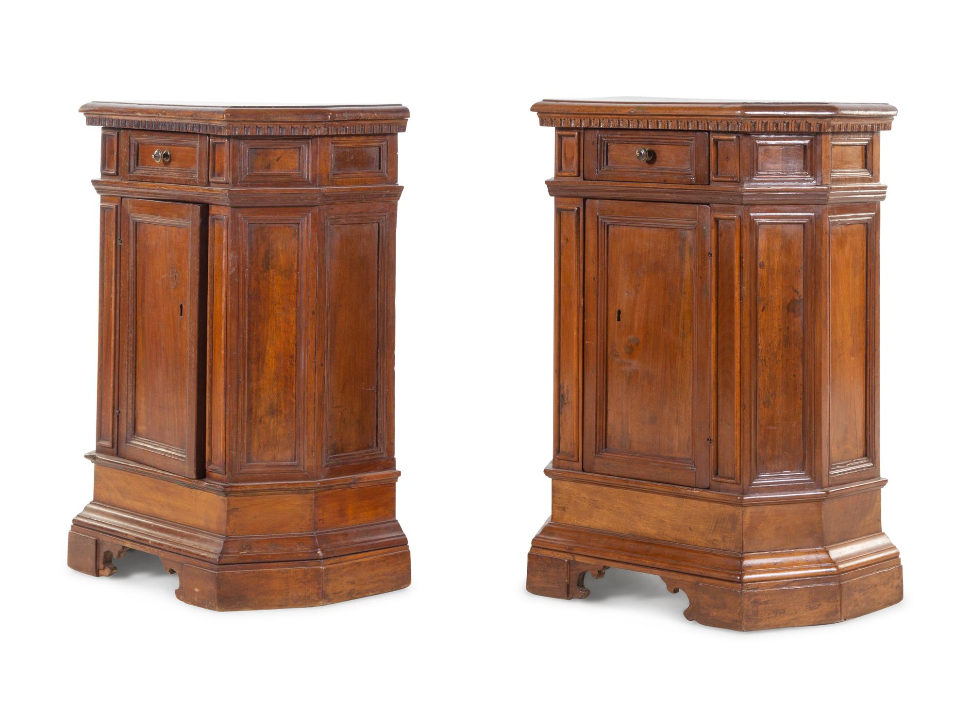 A Pair of North Italian Carved and Paneled Walnut Cabinets