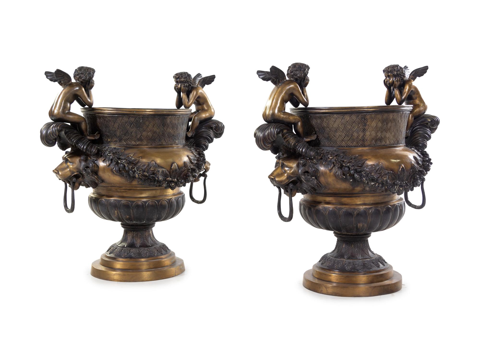 A Pair of Continental Gilt and Patinated Bronze Urns