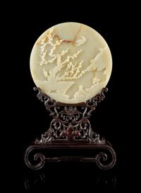 A Carved Celadon Jade Table Screen Diameter of jade 8 1/4 inches. — QING DYNASTY