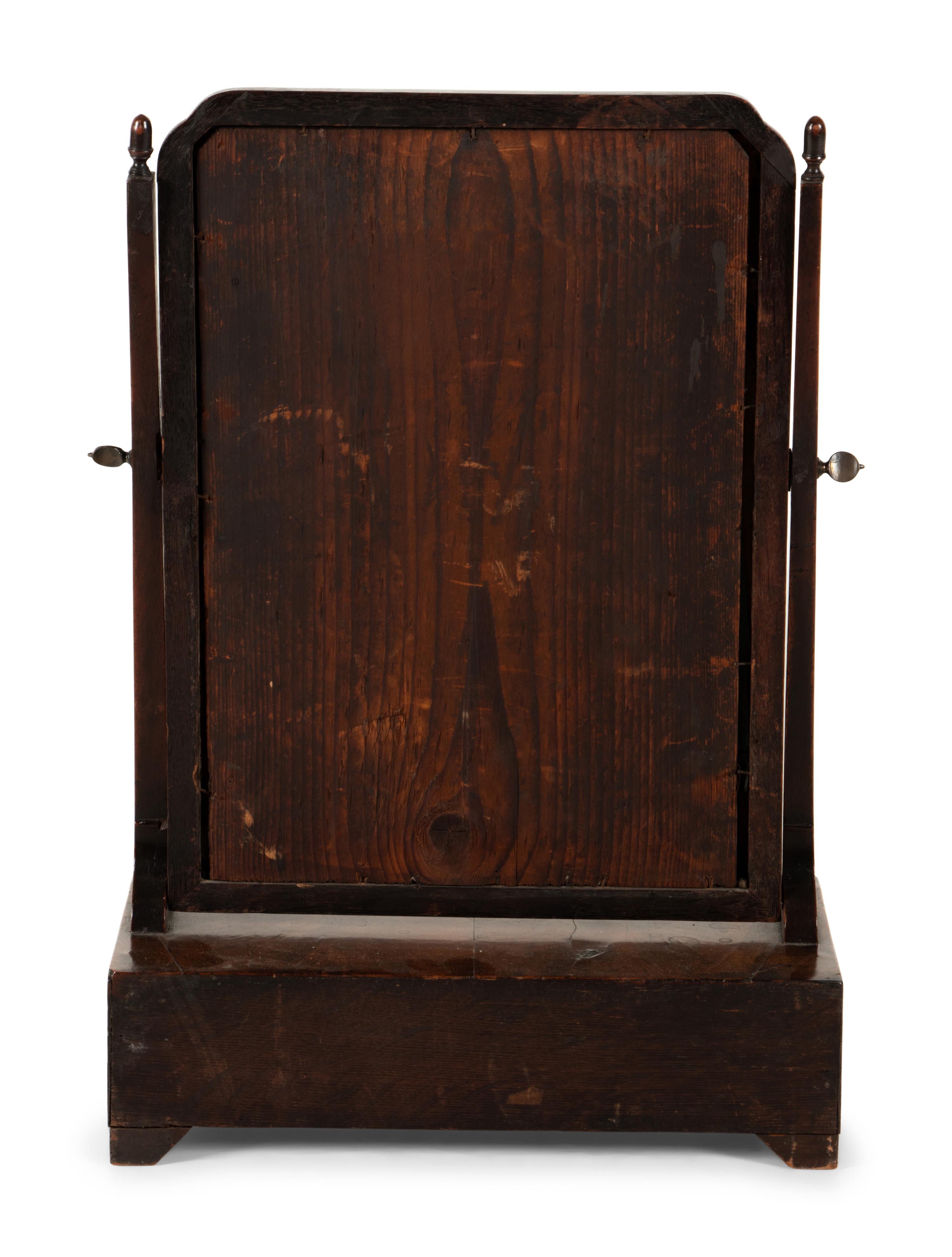 A George II Parcel Gilt Walnut Dressing Mirror