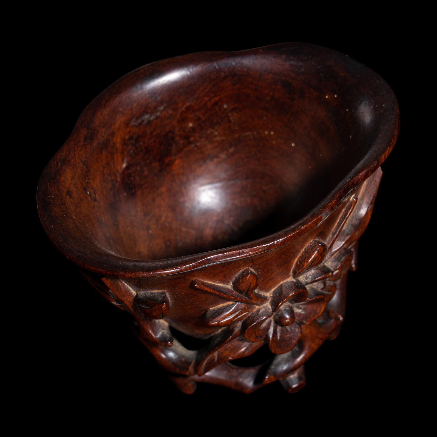 A Carved Huanghuali 'Peaches' Libation Cup