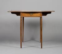 A George III Pembroke Table, Height 28 1/4 x width 17 3/4 x depth 32 1/2 inches closed.