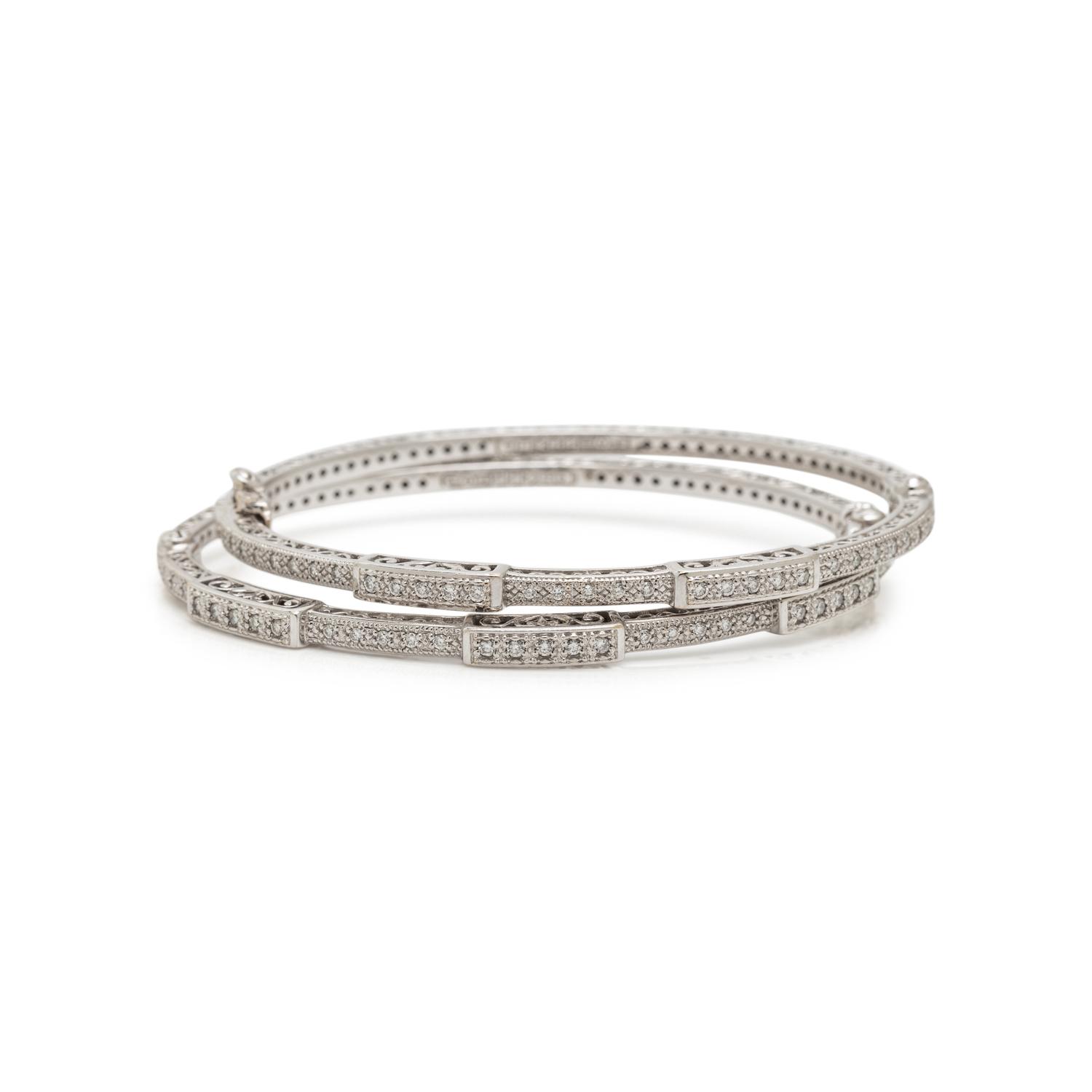CHARIOL, PAIR OF WHITE GOLD AND DIAMOND BANGLE BRACELETS