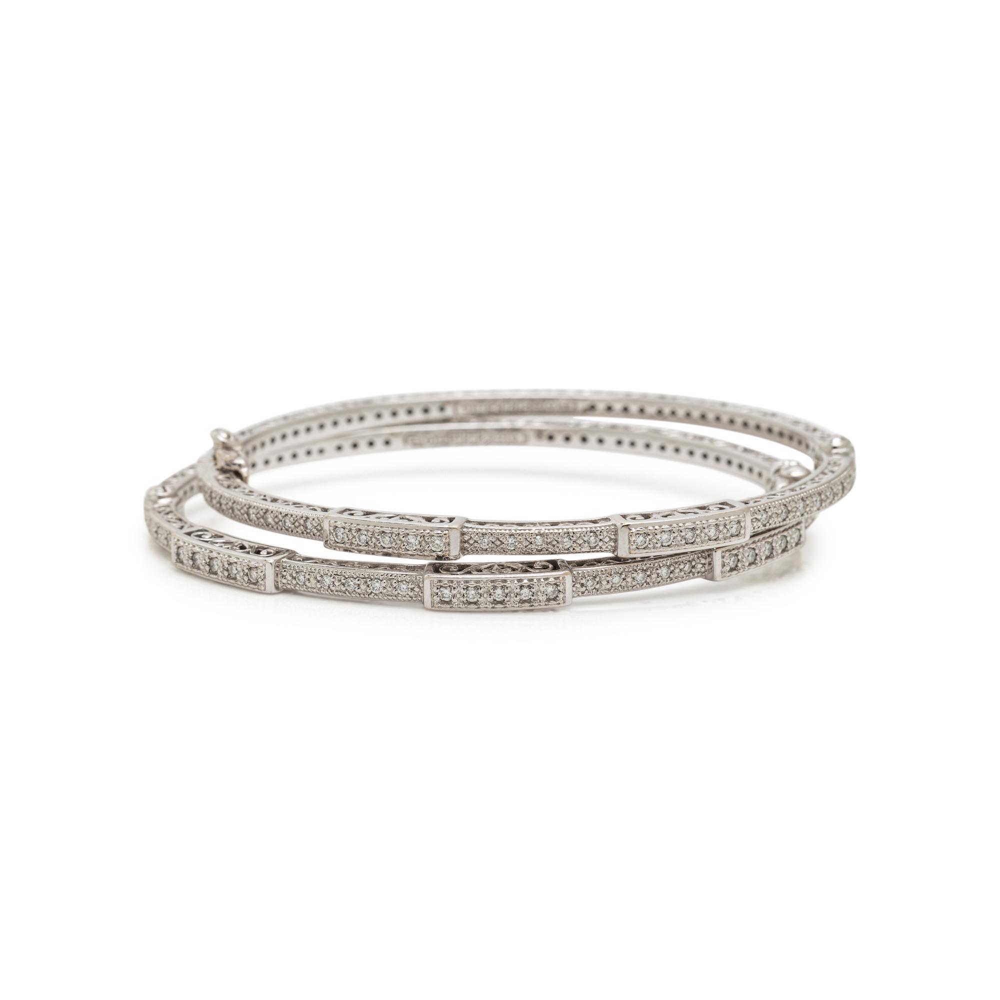 CHARIOL, PAIR OF WHITE GOLD AND DIAMOND BANGLE BRACELETS