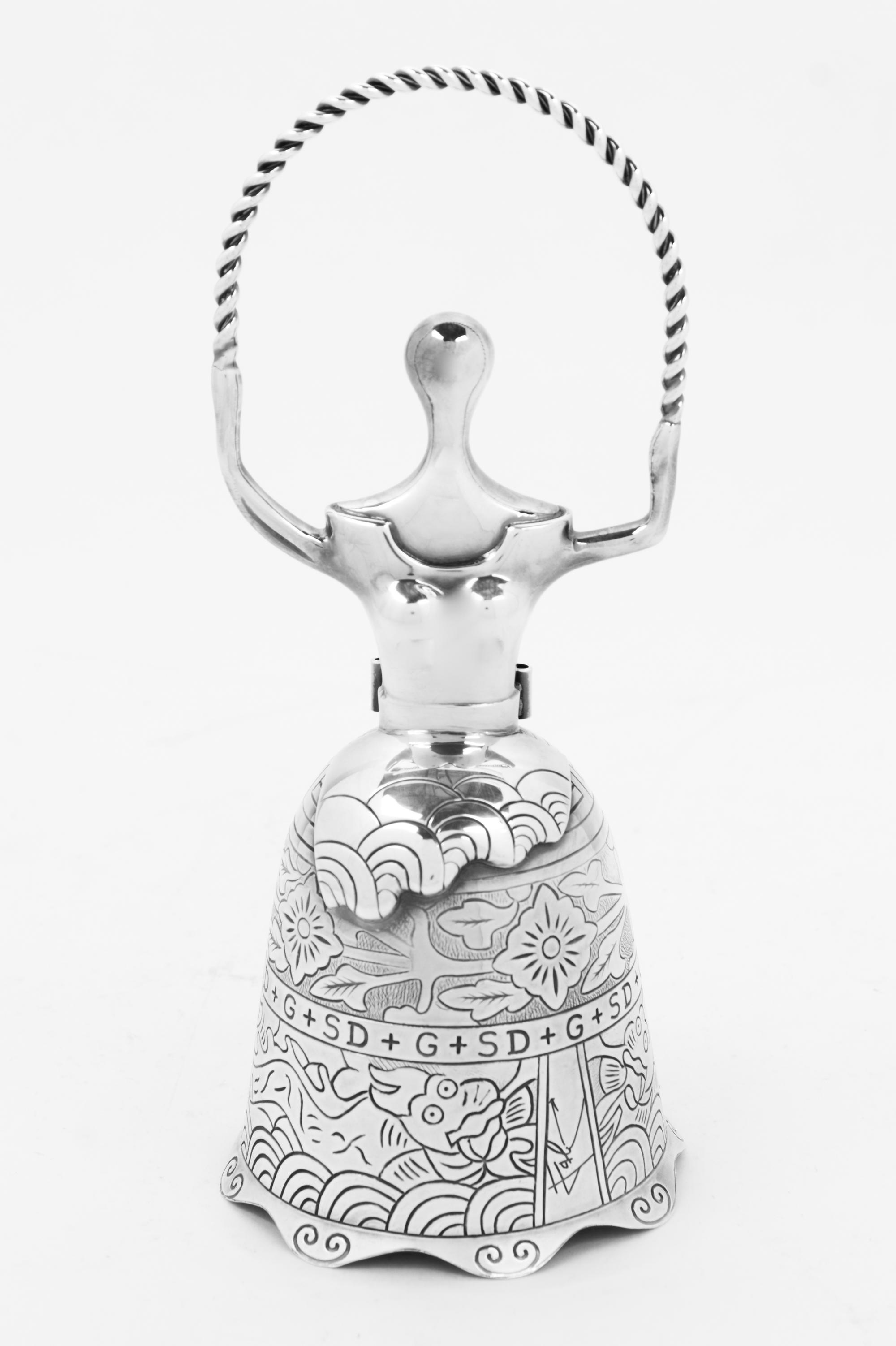 An American Silver Figural Bell, The Lincoln Mint, Second Half 20th Century, Alice in Wonderland by Salvador Dali with fitted case.