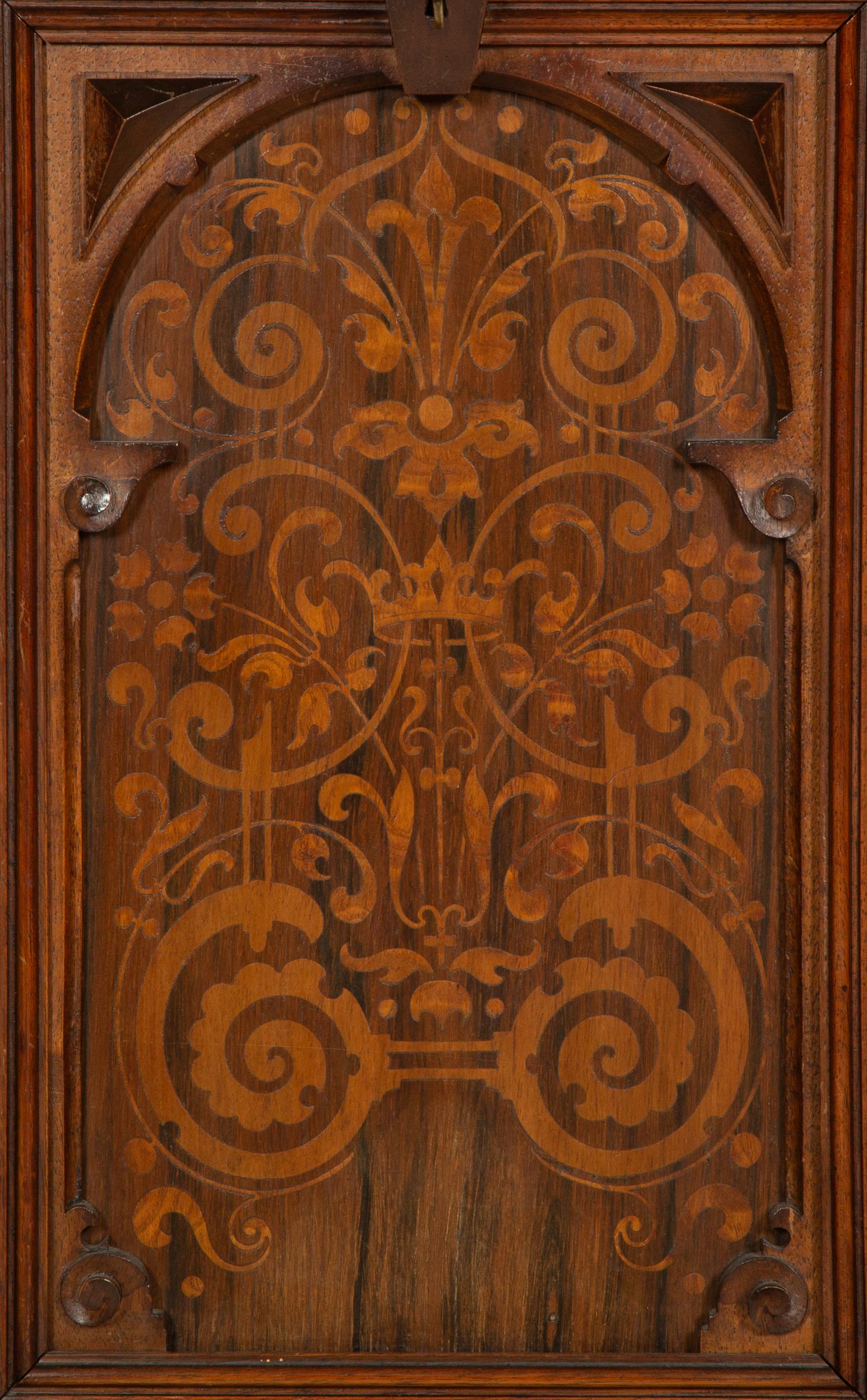 A German Carved Walnut and Marquetry Tall Case Clock