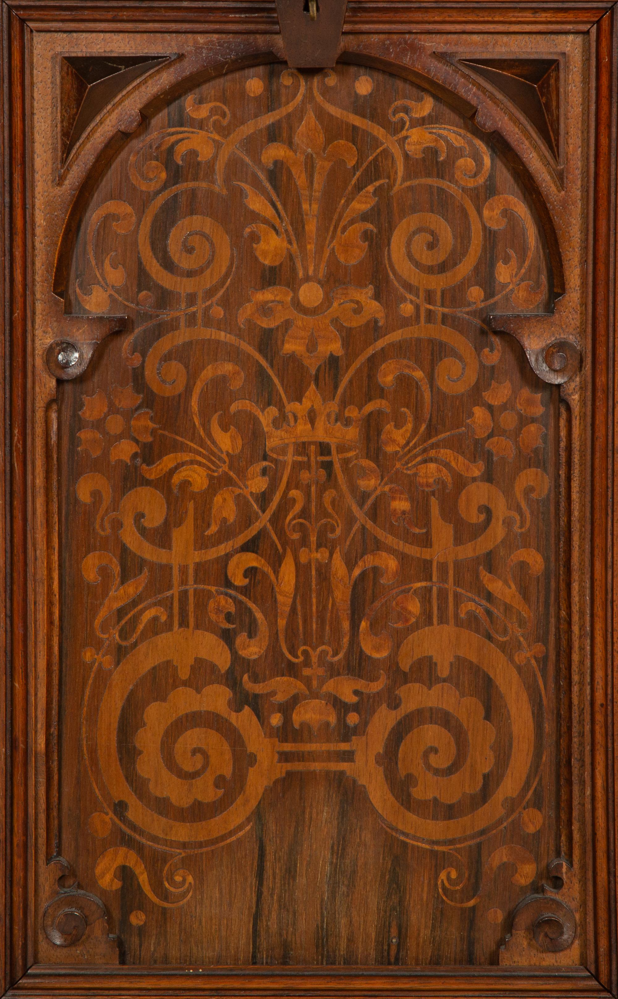 A German Carved Walnut and Marquetry Tall Case Clock