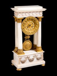 An Empire Style Gilt Bronze Mounted Marble Clock