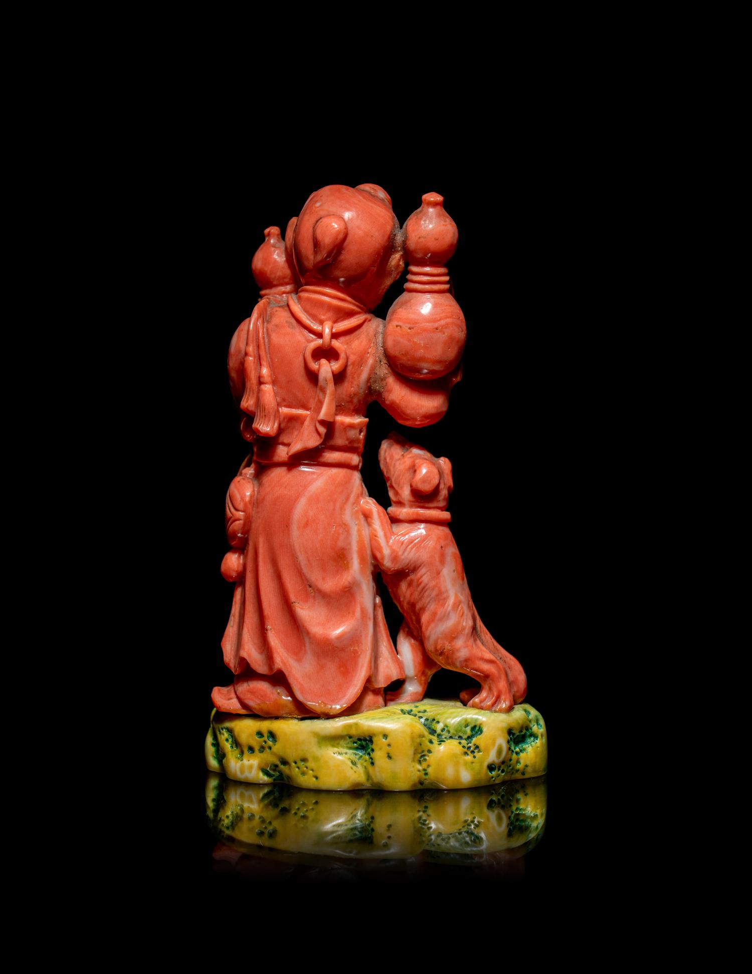 A Chinese Coral Figural Group of a Boy and a Dog
