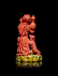 A Chinese Coral Figural Group of a Boy and a Dog