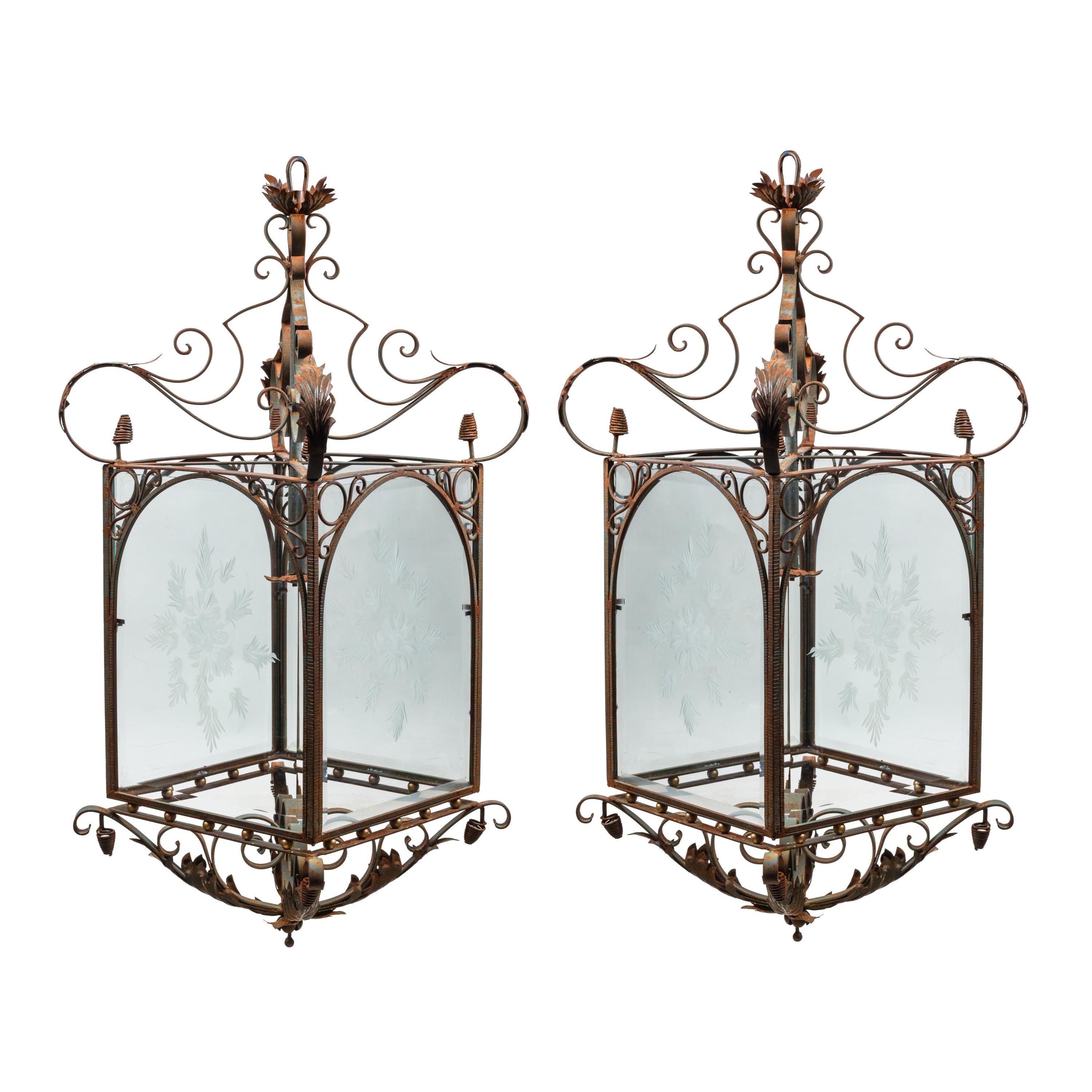 A Pair of Spanish Iron and Etched Glass Hall Lanterns
