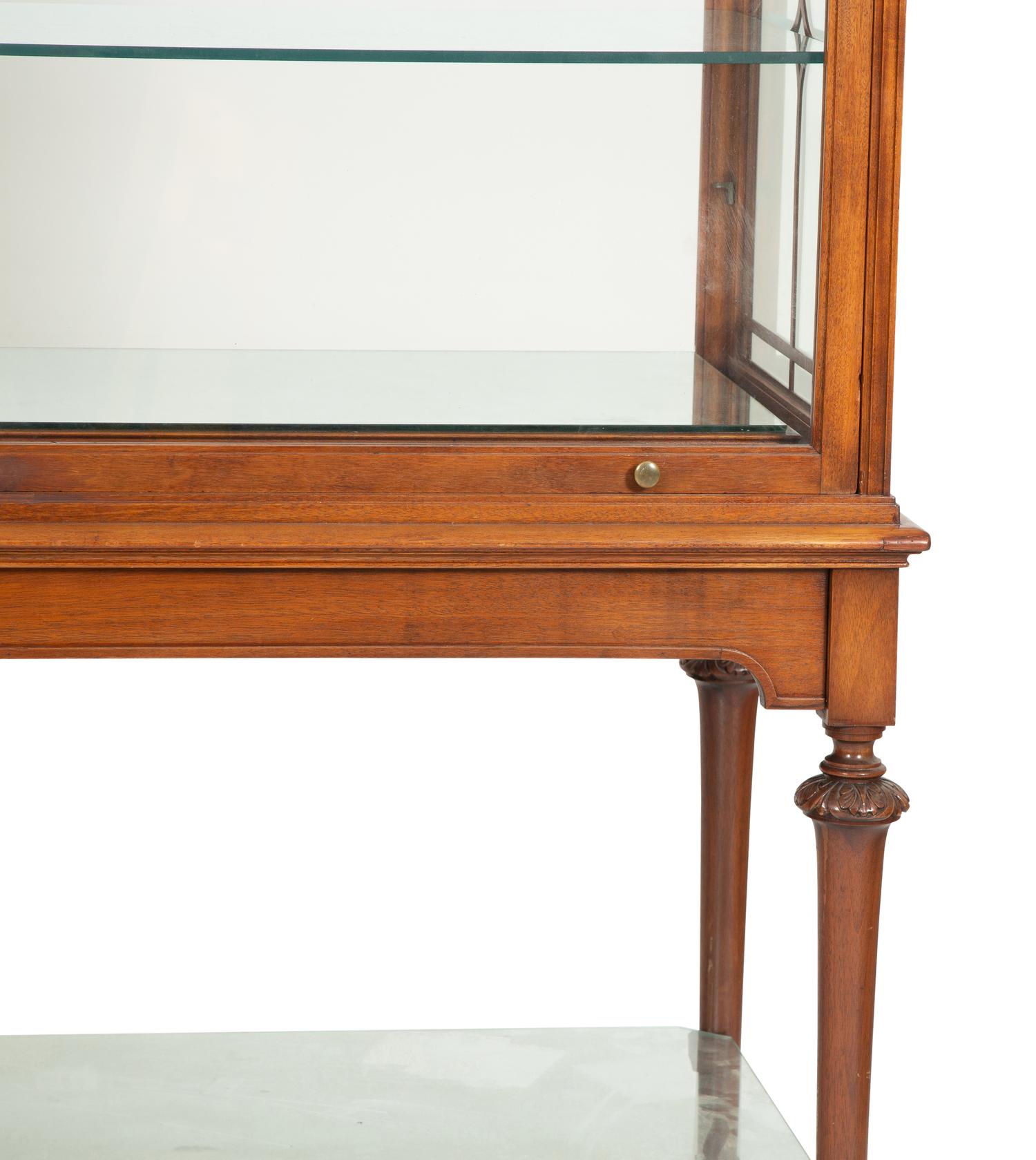 A Regency Style Mahogany Glazed Display Cabinet on Stand