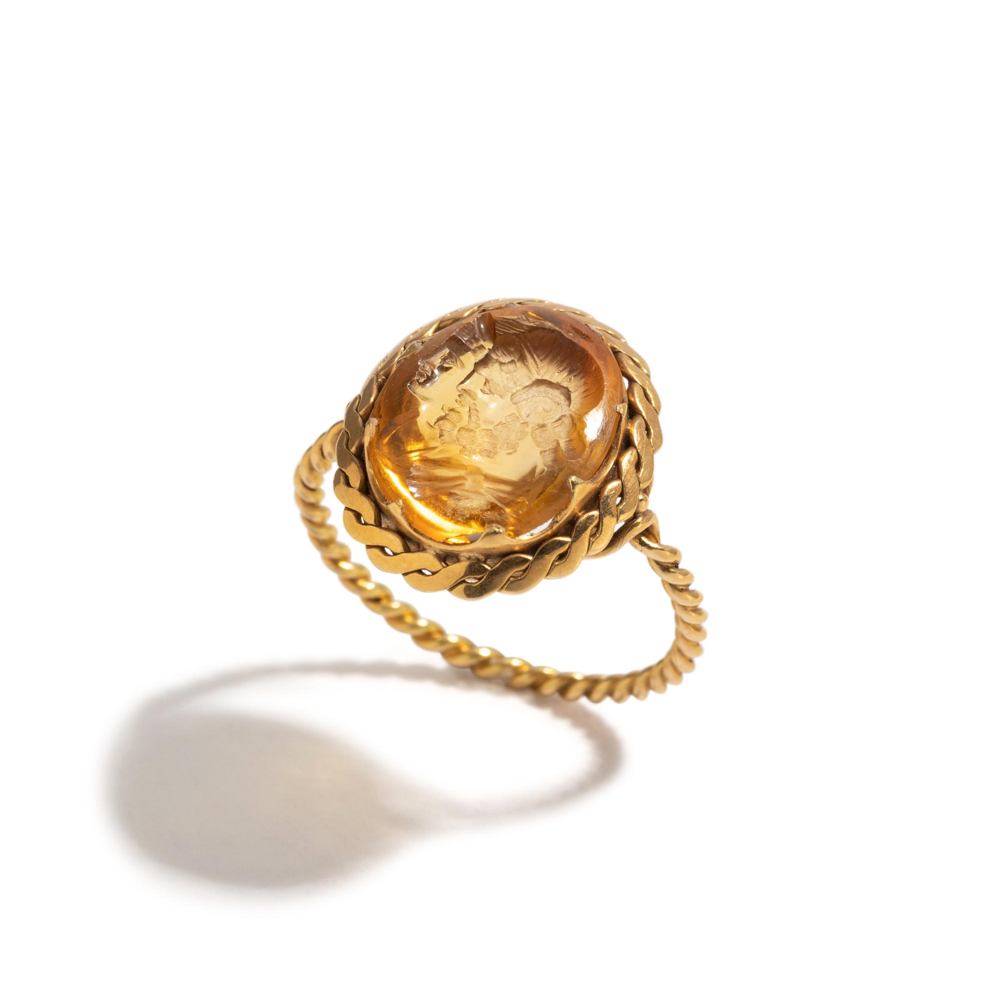 A Neoclassical Gold and Citrine Finger Ring with a Double Bust of Jupiter-Ammon and Juno-Isis