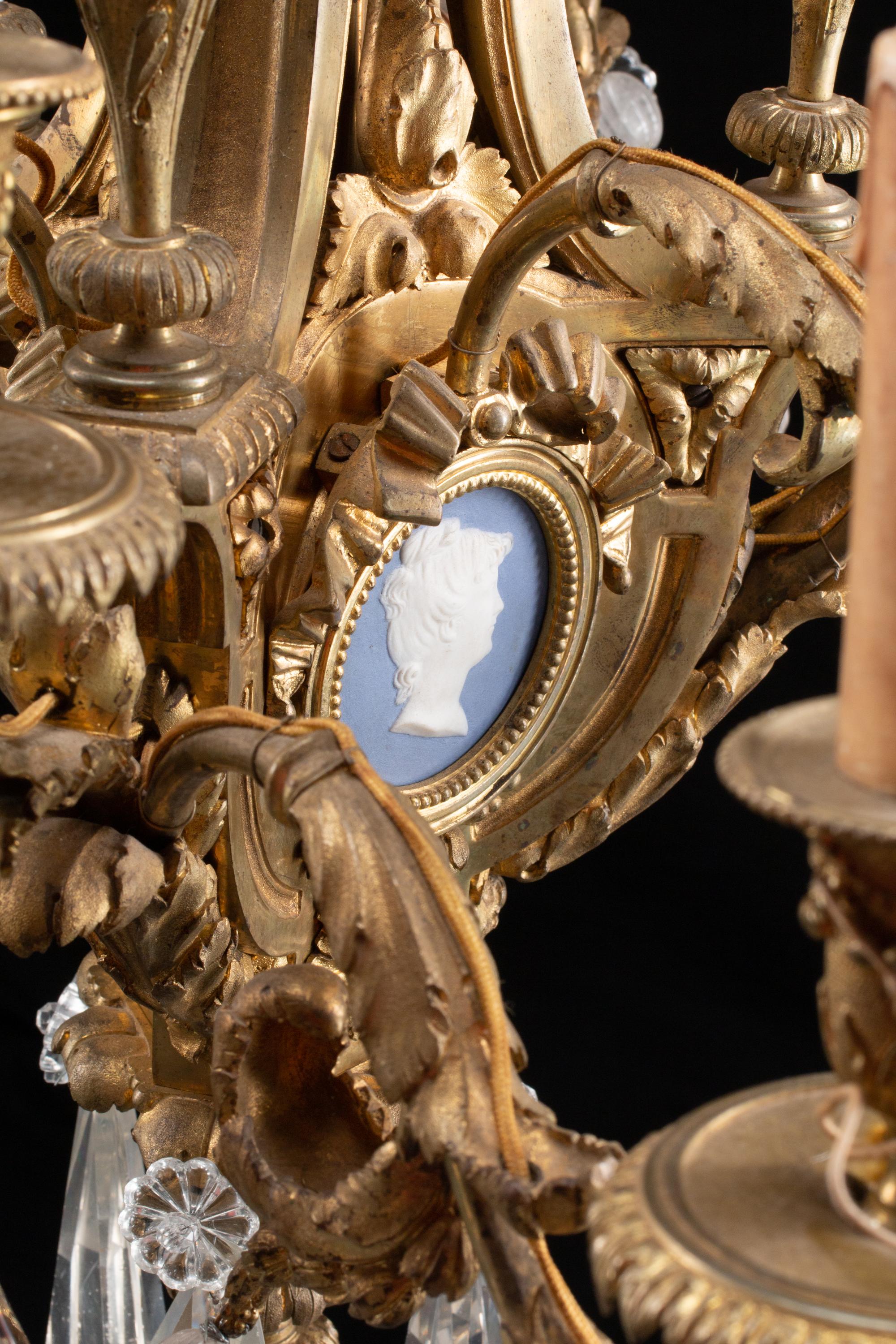 A Gilt-Bronze, Rock Crystal and Glass Twelve-Light Chandelier