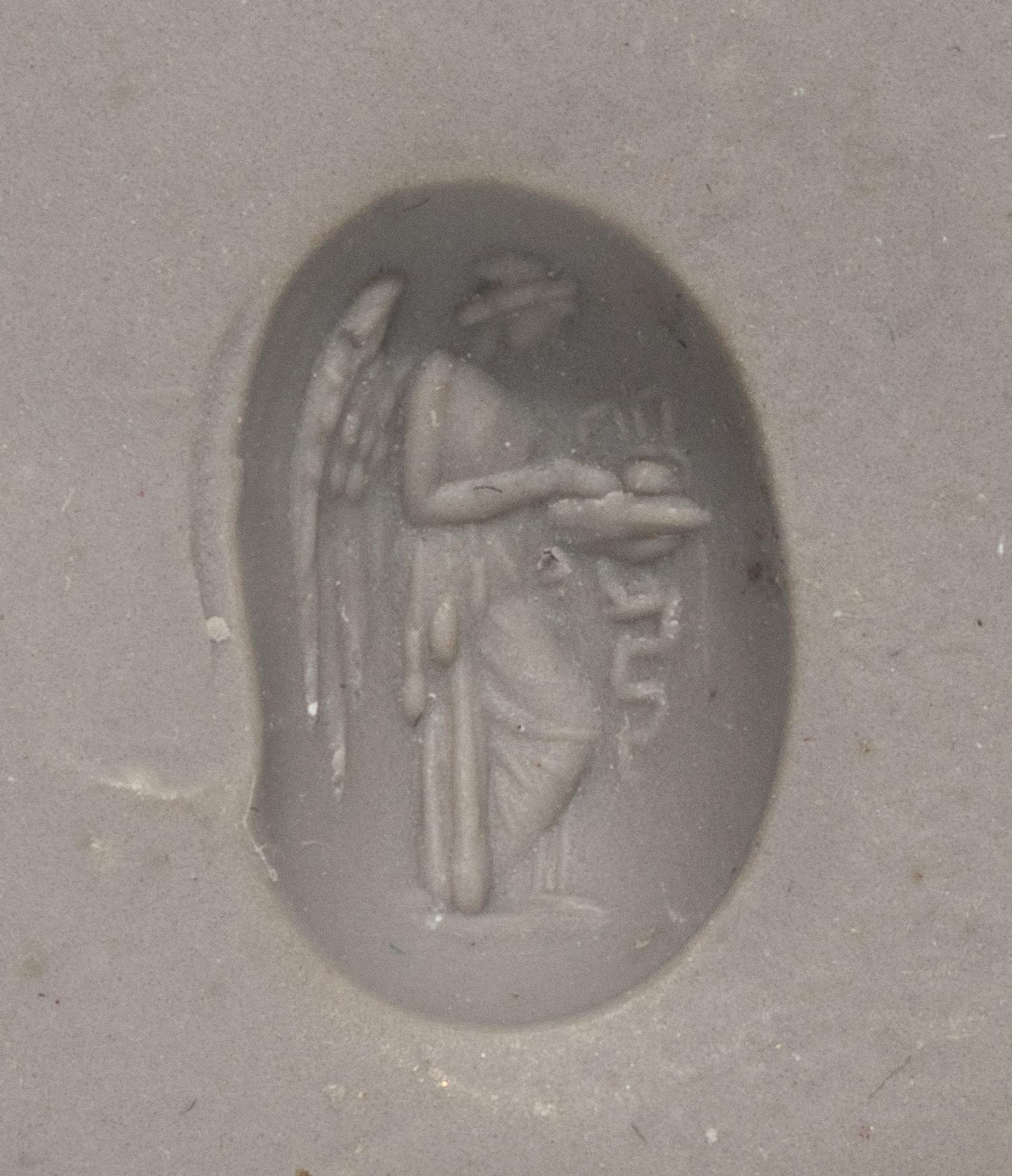 A Roman Garnet Ring Stone with the Goddess Nike at an Altar