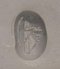 A Roman Garnet Ring Stone with the Goddess Nike at an Altar