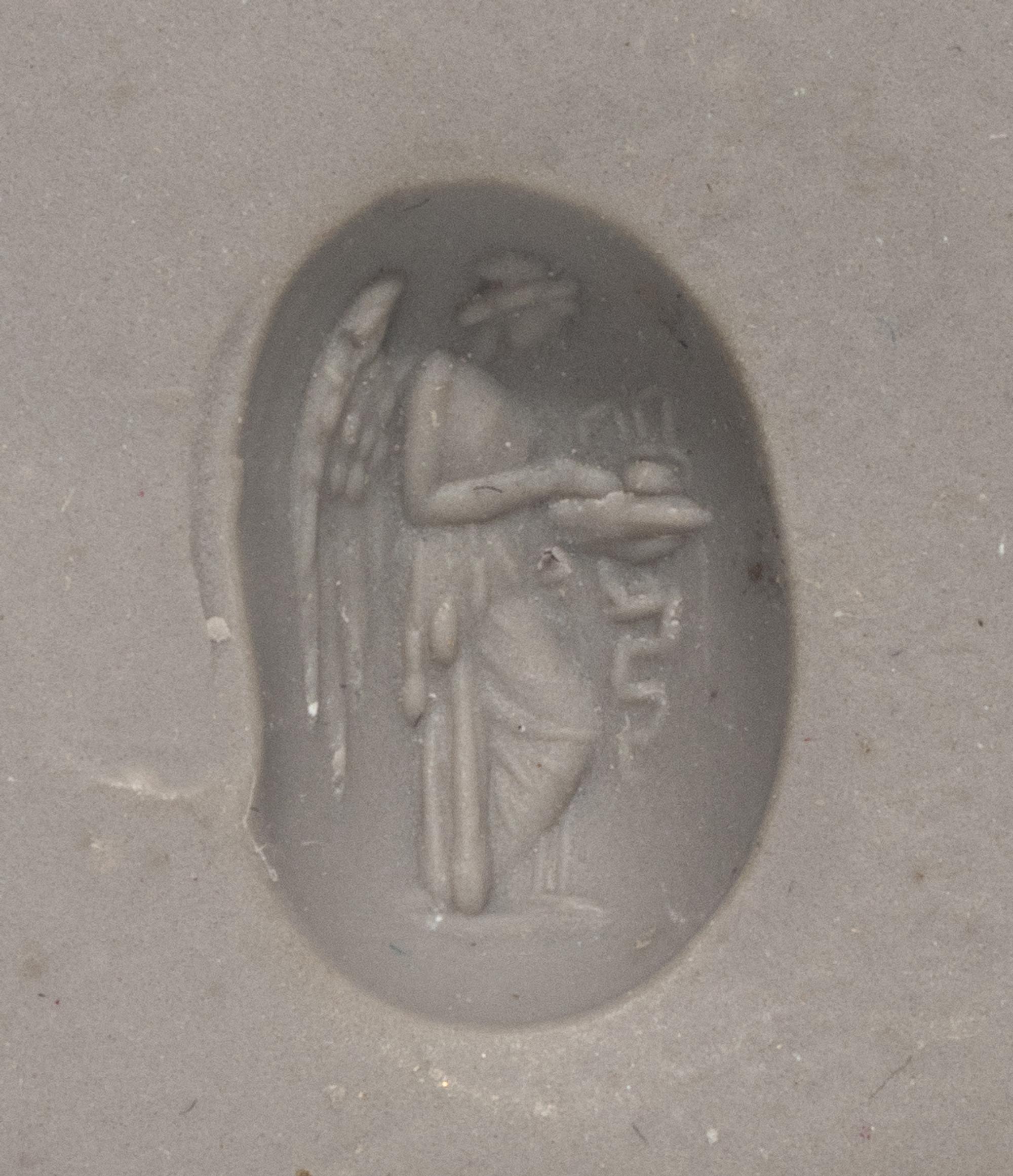 A Roman Garnet Ring Stone with the Goddess Nike at an Altar