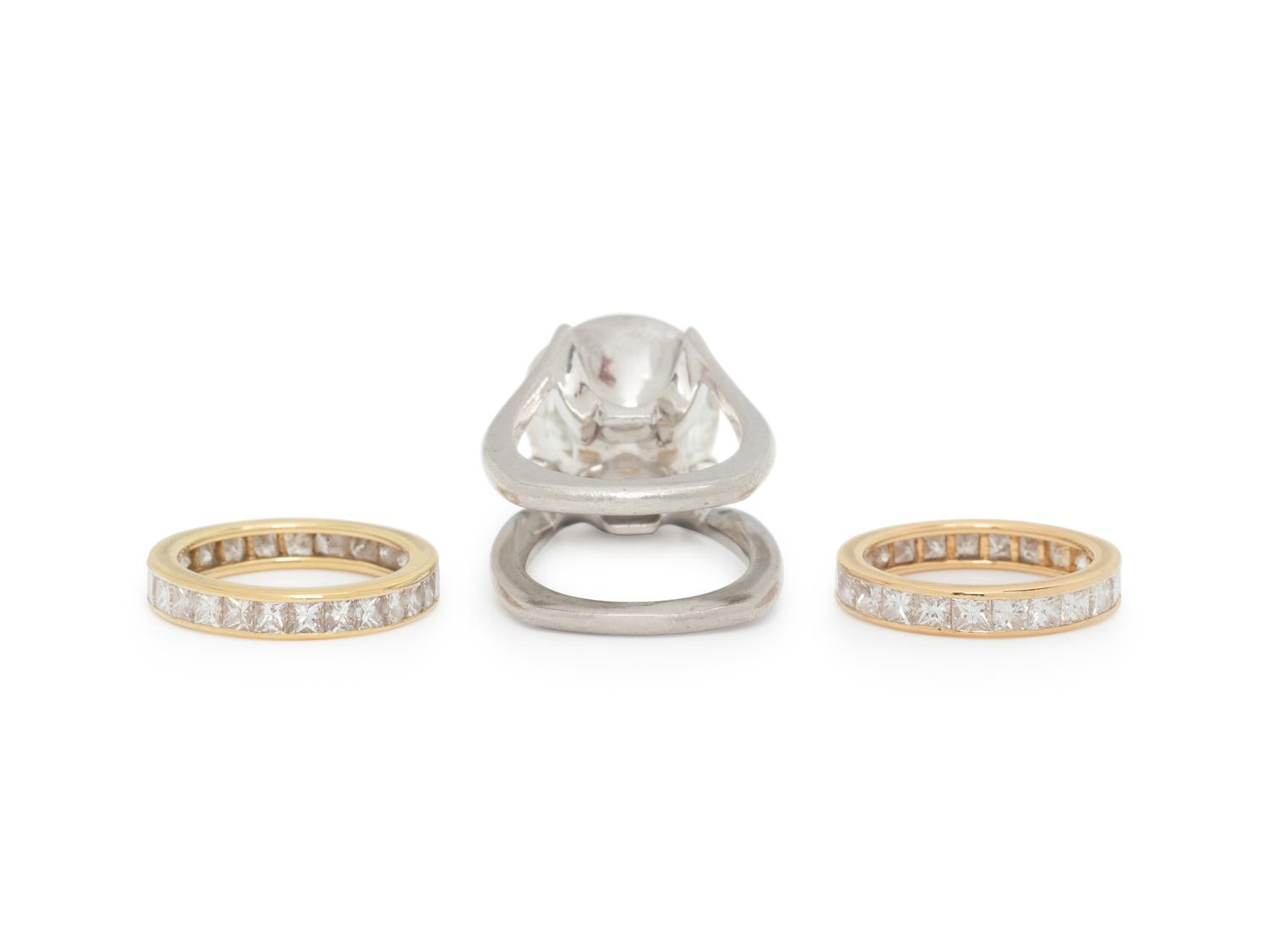 DIAMOND AND PLATINUM RING WITH PAIR OF ETERNITY BANDS