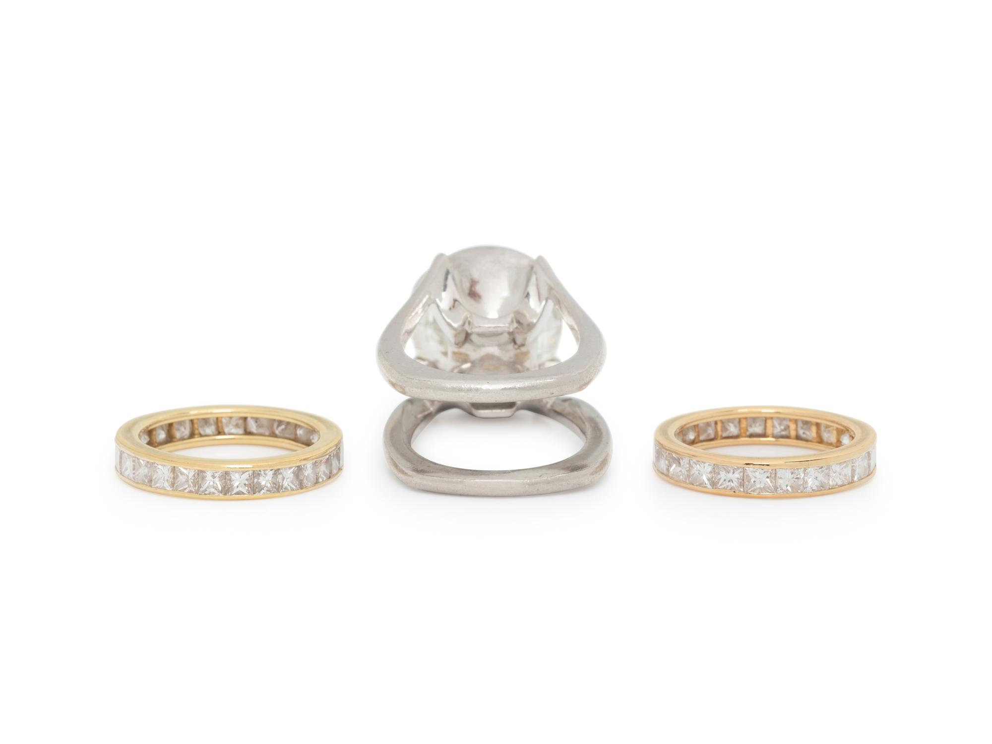 DIAMOND AND PLATINUM RING WITH PAIR OF ETERNITY BANDS