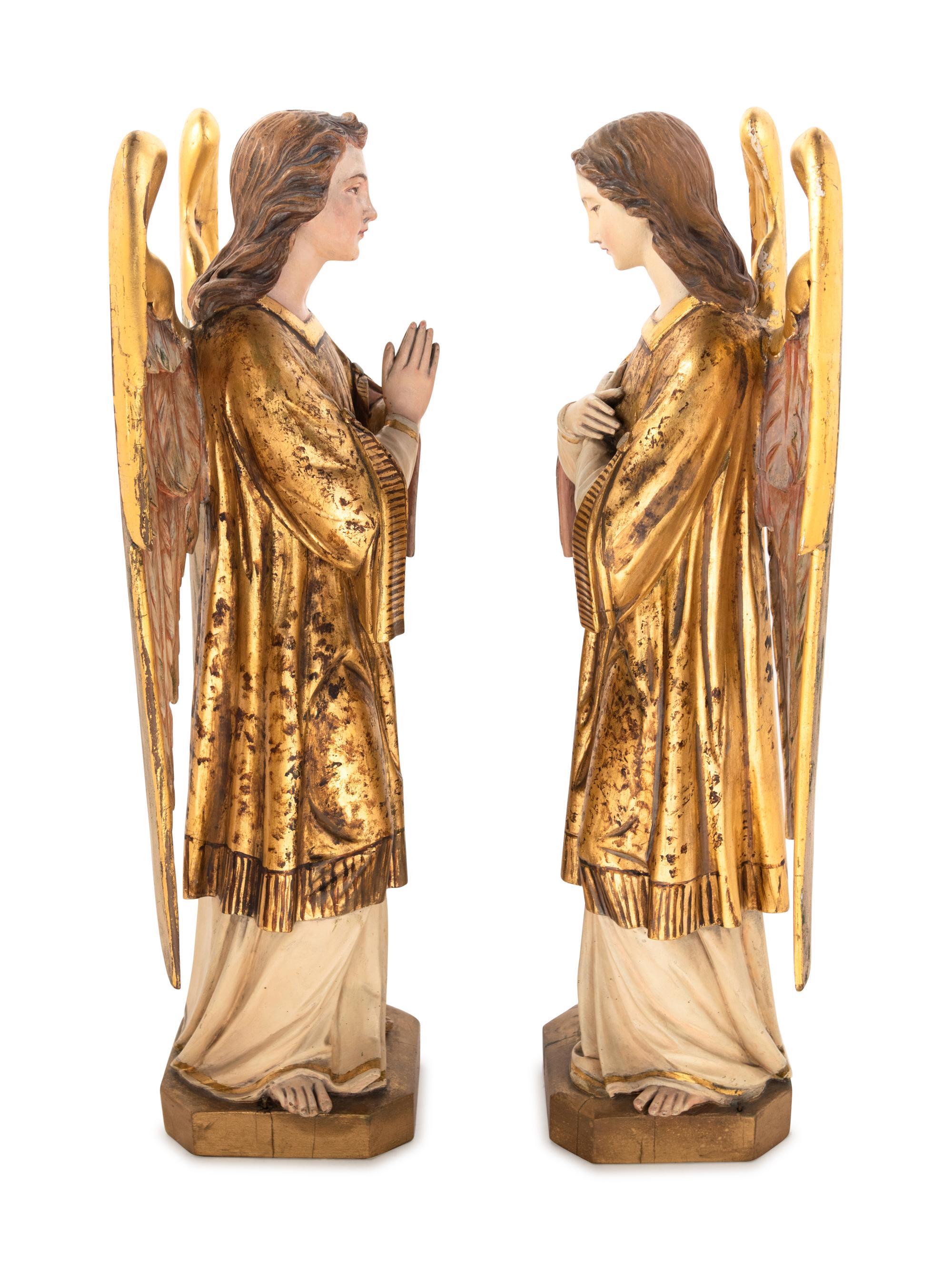 A Pair of Italian Painted and Parcel Gilt Figures of Angels