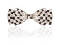 An Art Deco Platinum, Diamond and Onyx Bow Brooch, 3.70 dwts.