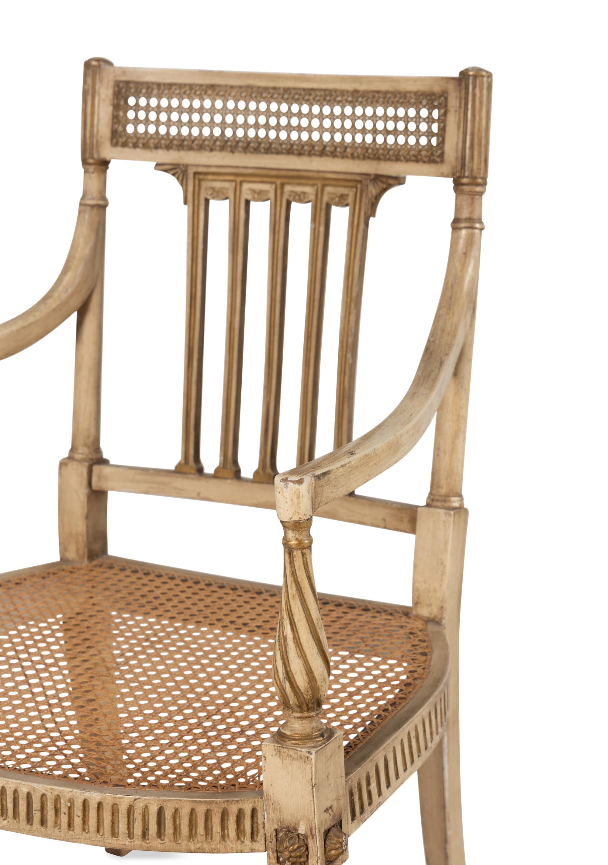 A Pair of Louis XVI Style Crème-Painted and Parcel-Gilt Fauteuils