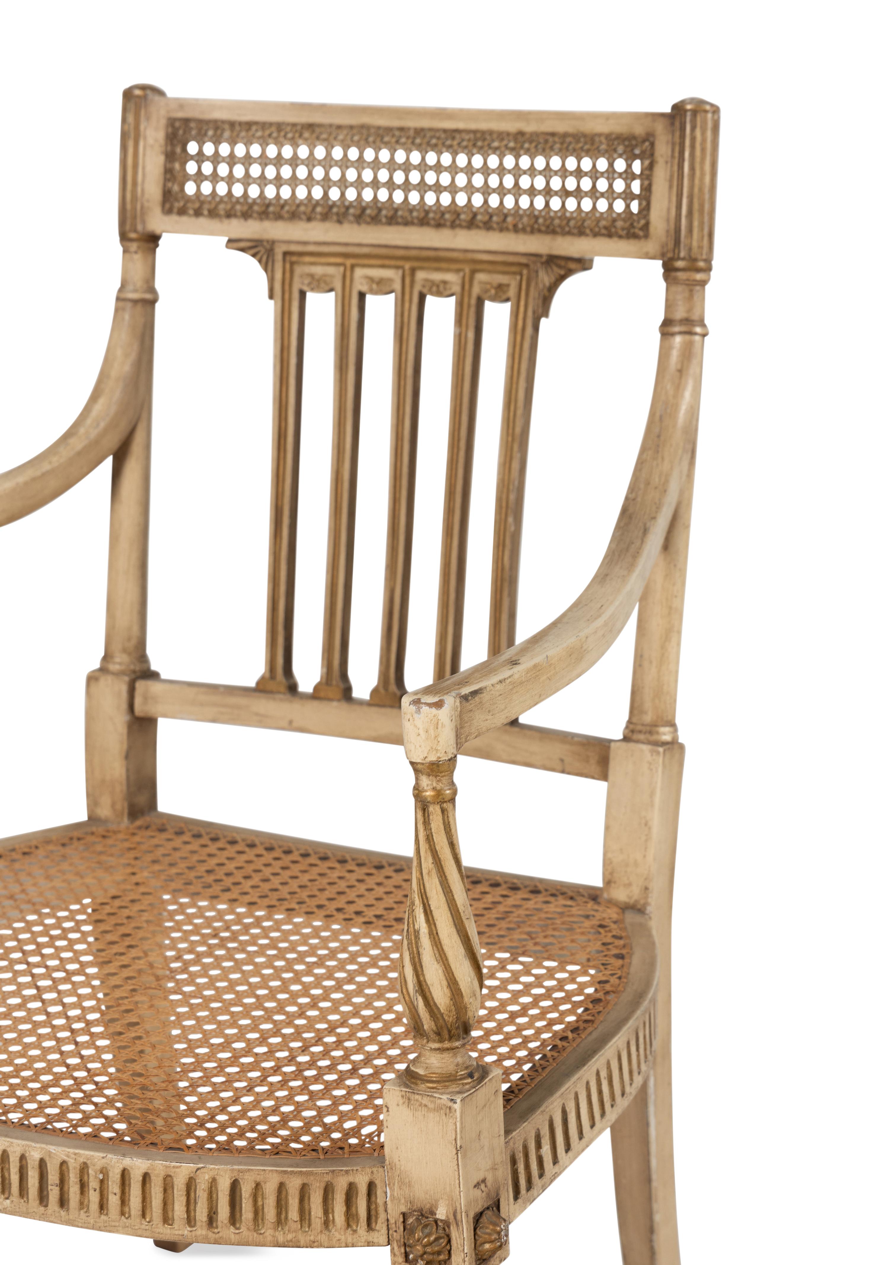 A Pair of Louis XVI Style Crème-Painted and Parcel-Gilt Fauteuils
