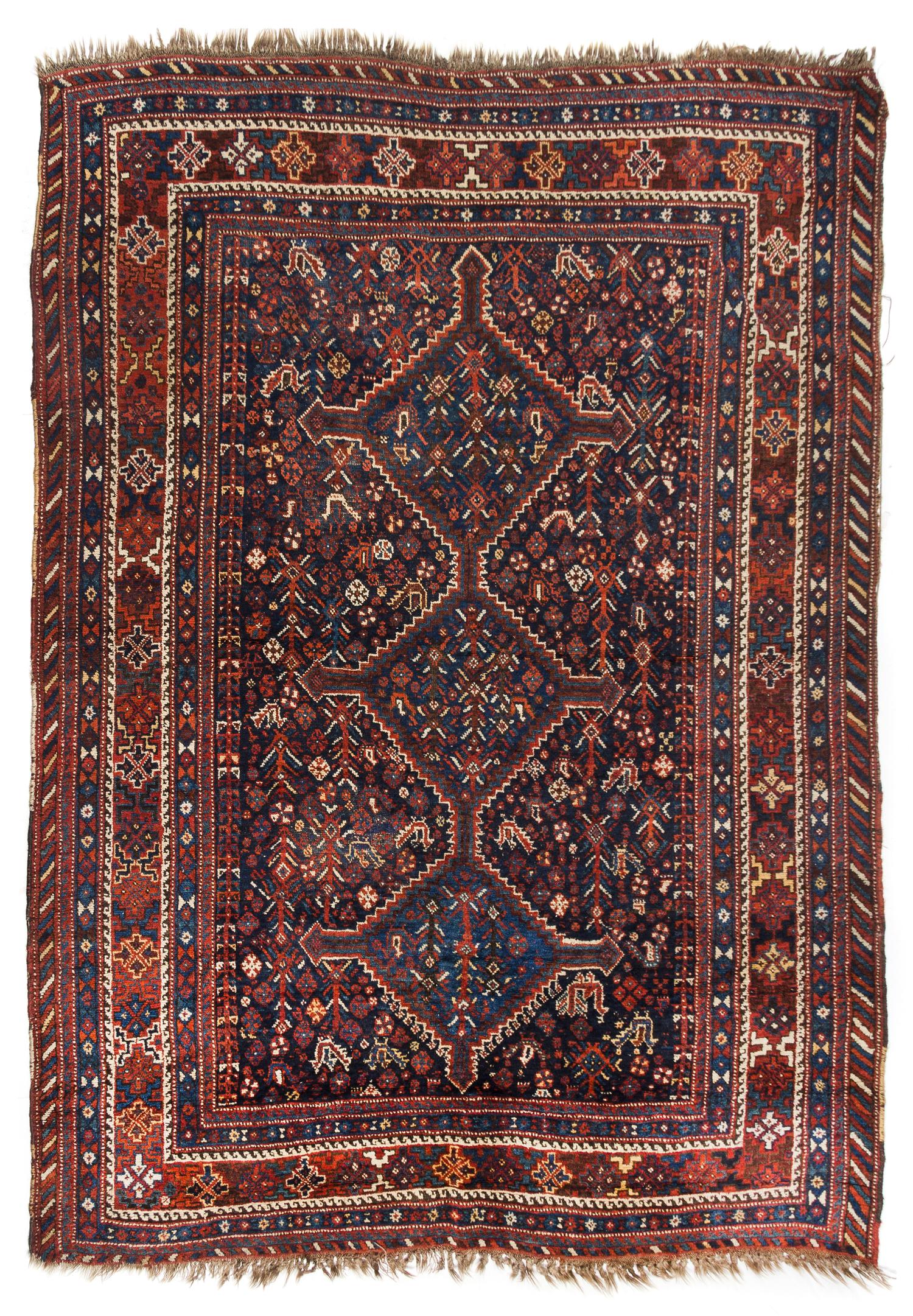 A Shiraz Wool Rug 5 feet 5 inches x 7 feet 4 inches. — WEST PERSIA, CIRCA 1920
