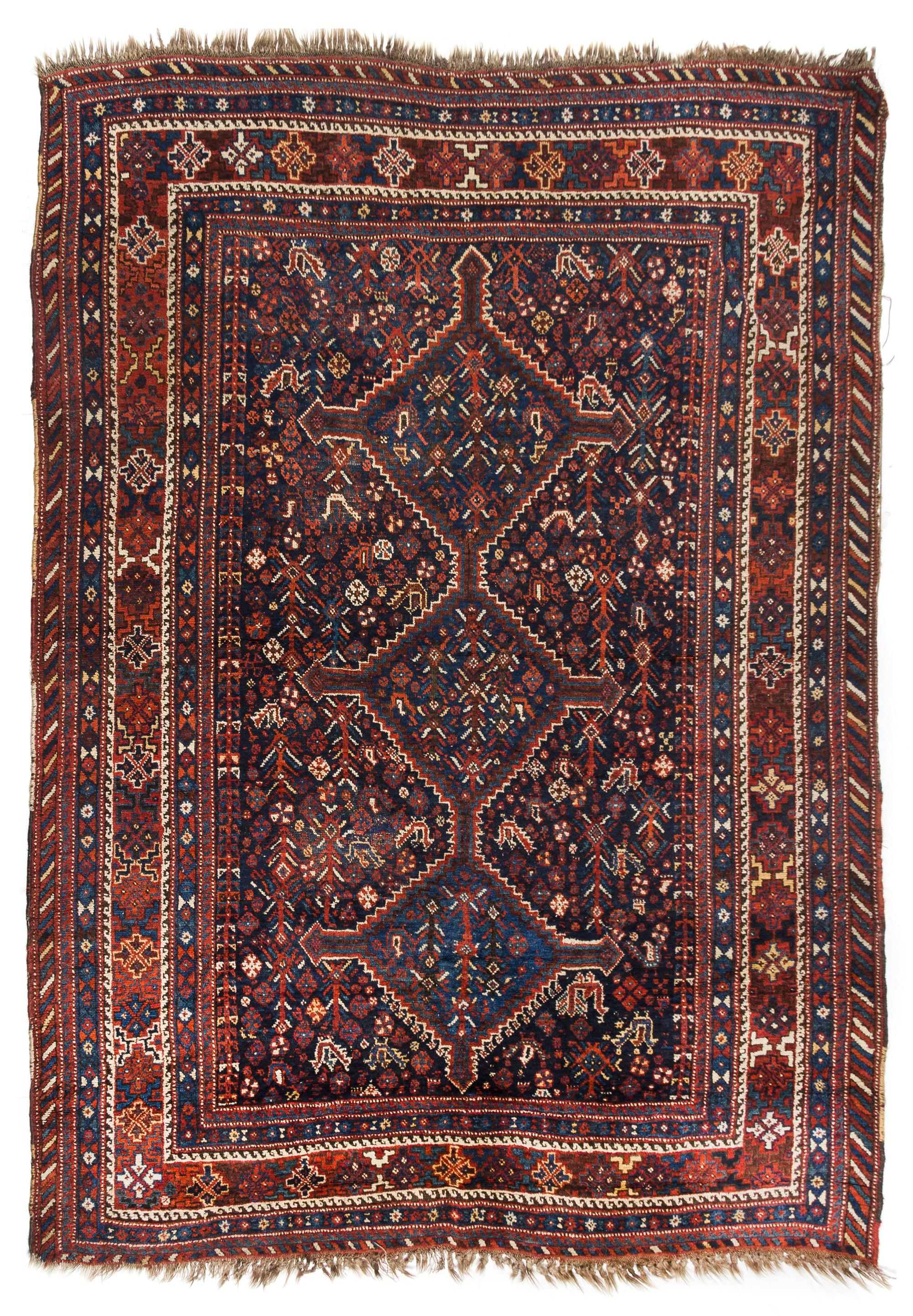 A Shiraz Wool Rug 5 feet 5 inches x 7 feet 4 inches. — WEST PERSIA, CIRCA 1920