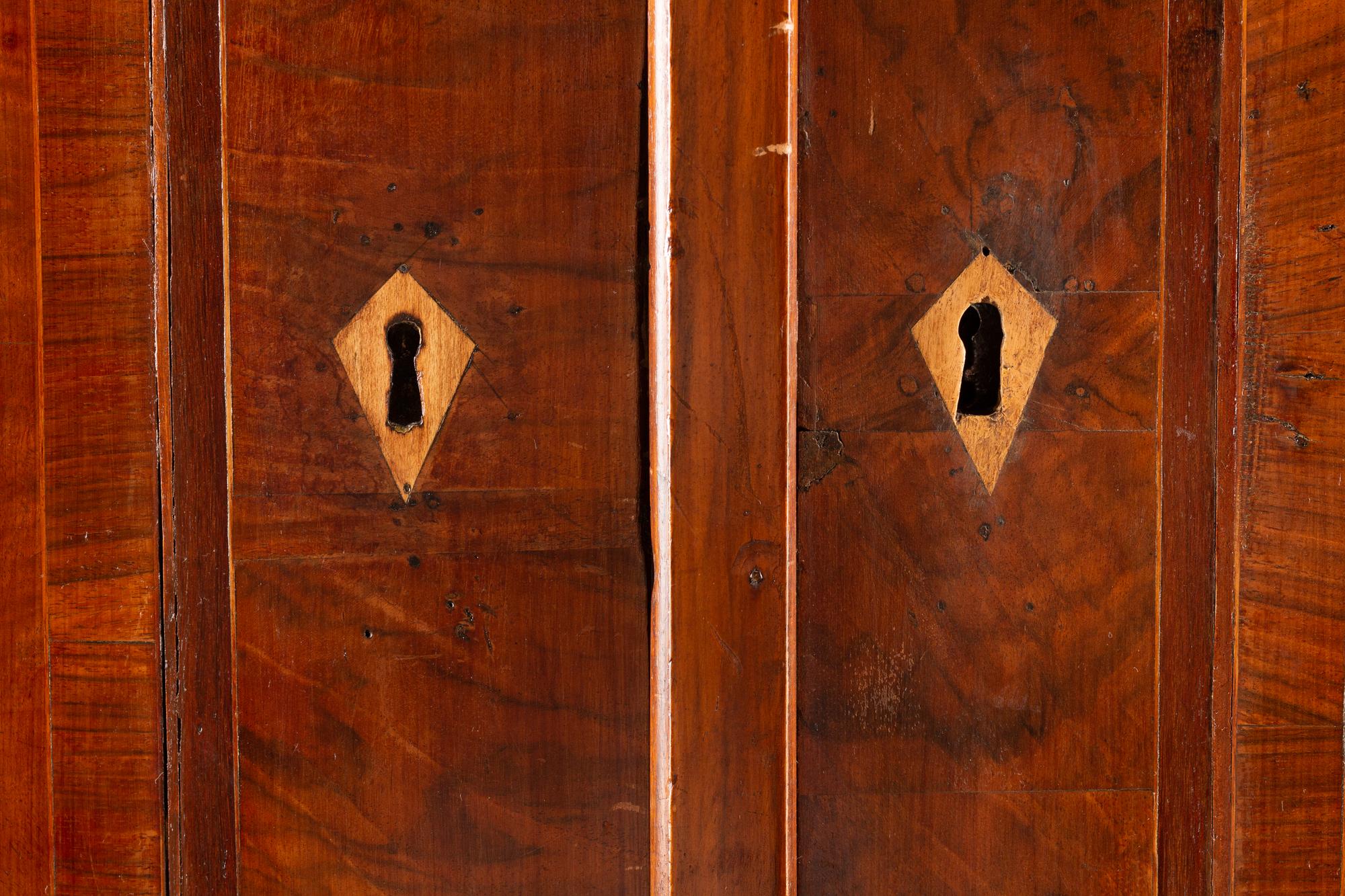 An Italian Parcel Ebonized Burl Walnut Cabinet-on-Chest
