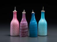Four Opalescent Glass Barber Bottles