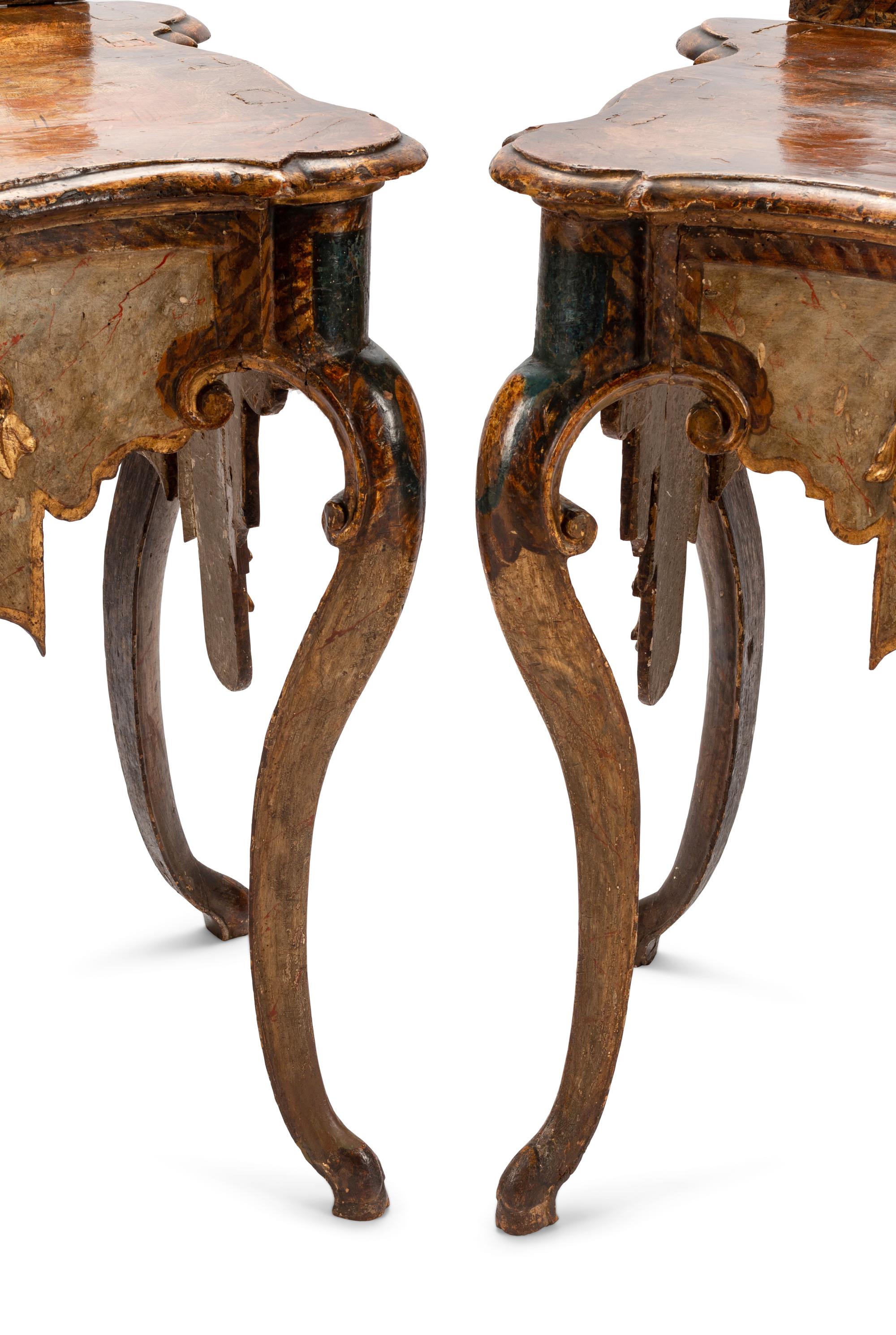 A Pair of Venetian Painted and Parcel Gilt Console Tables