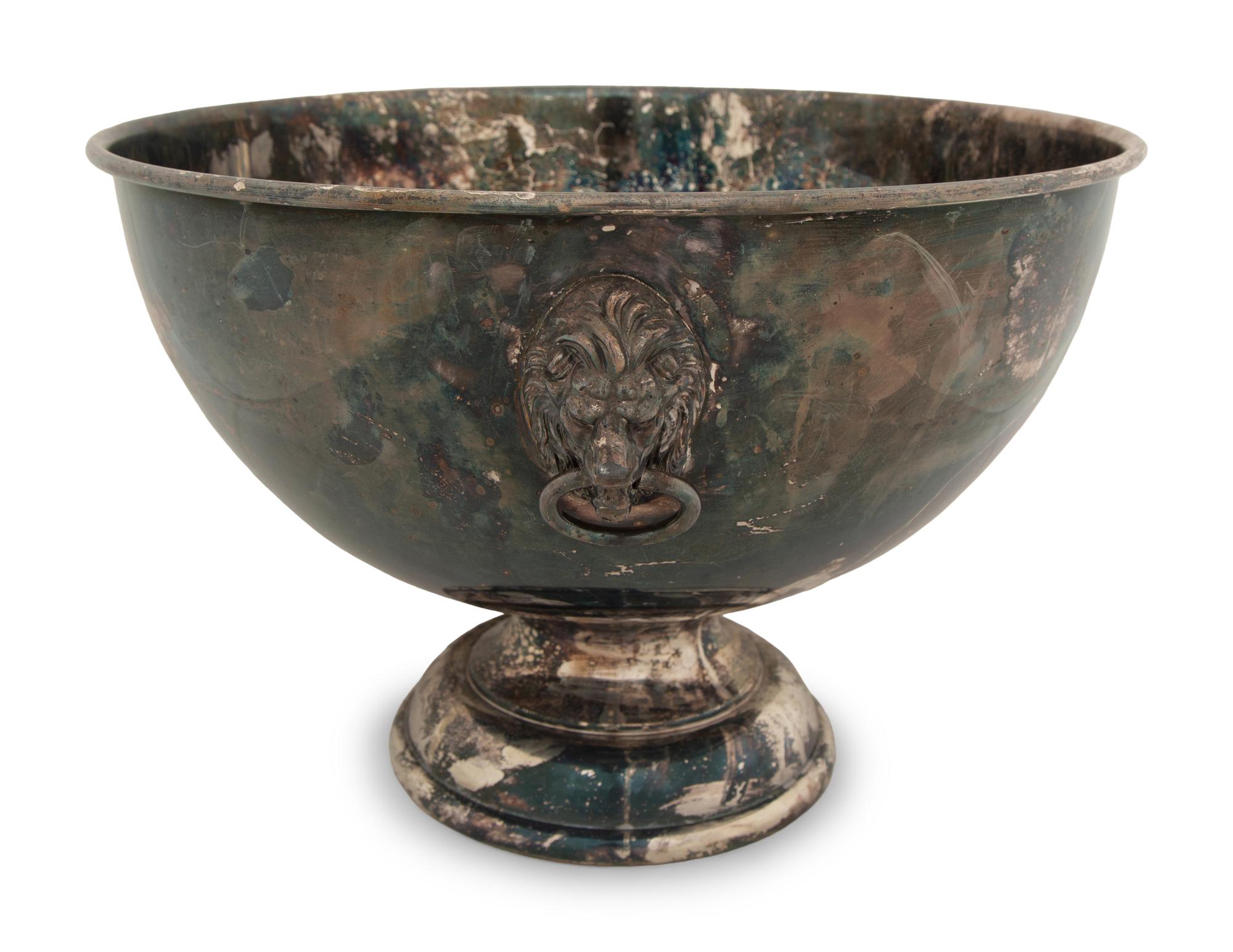 An Assembled Trio of Silverplate Footed Punch Bowls with Lionhead Handles