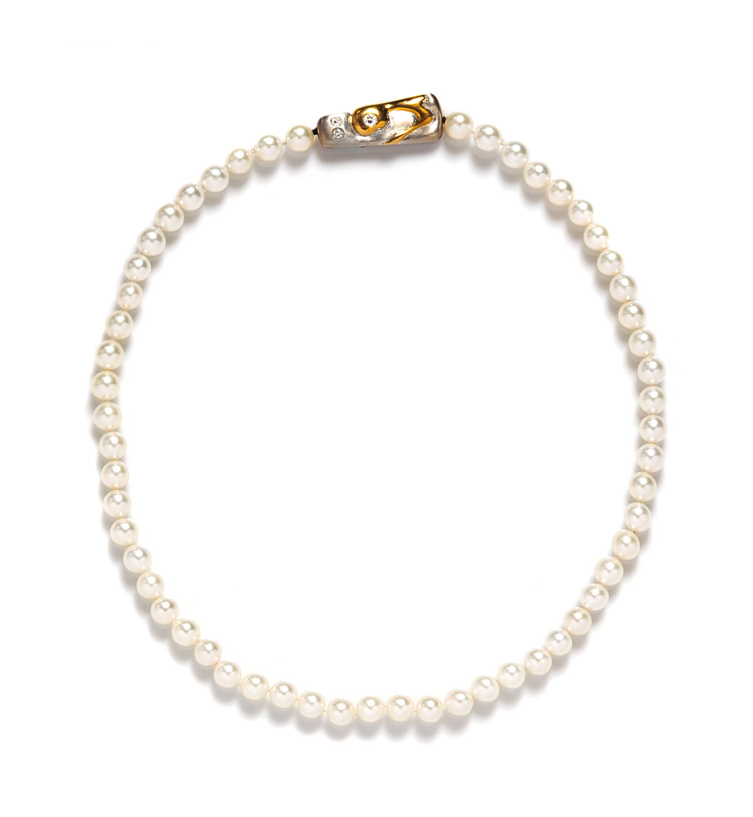 An 18 Karat Two Tone Gold, Cultured South Sea Pearl and Diamond Necklace, 6.20 dwts. (brooch only)