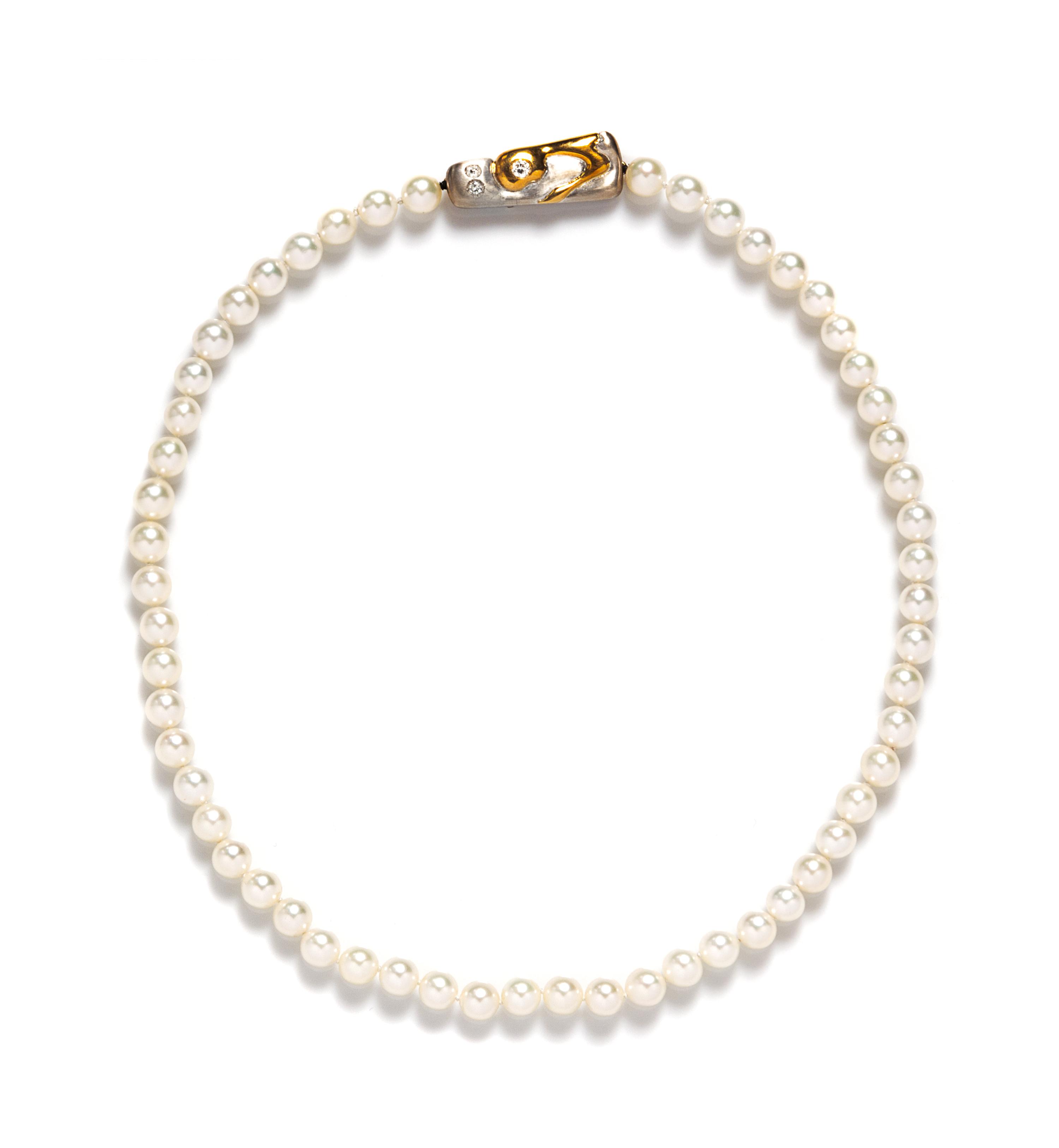 An 18 Karat Two Tone Gold, Cultured South Sea Pearl and Diamond Necklace, 6.20 dwts. (brooch only)
