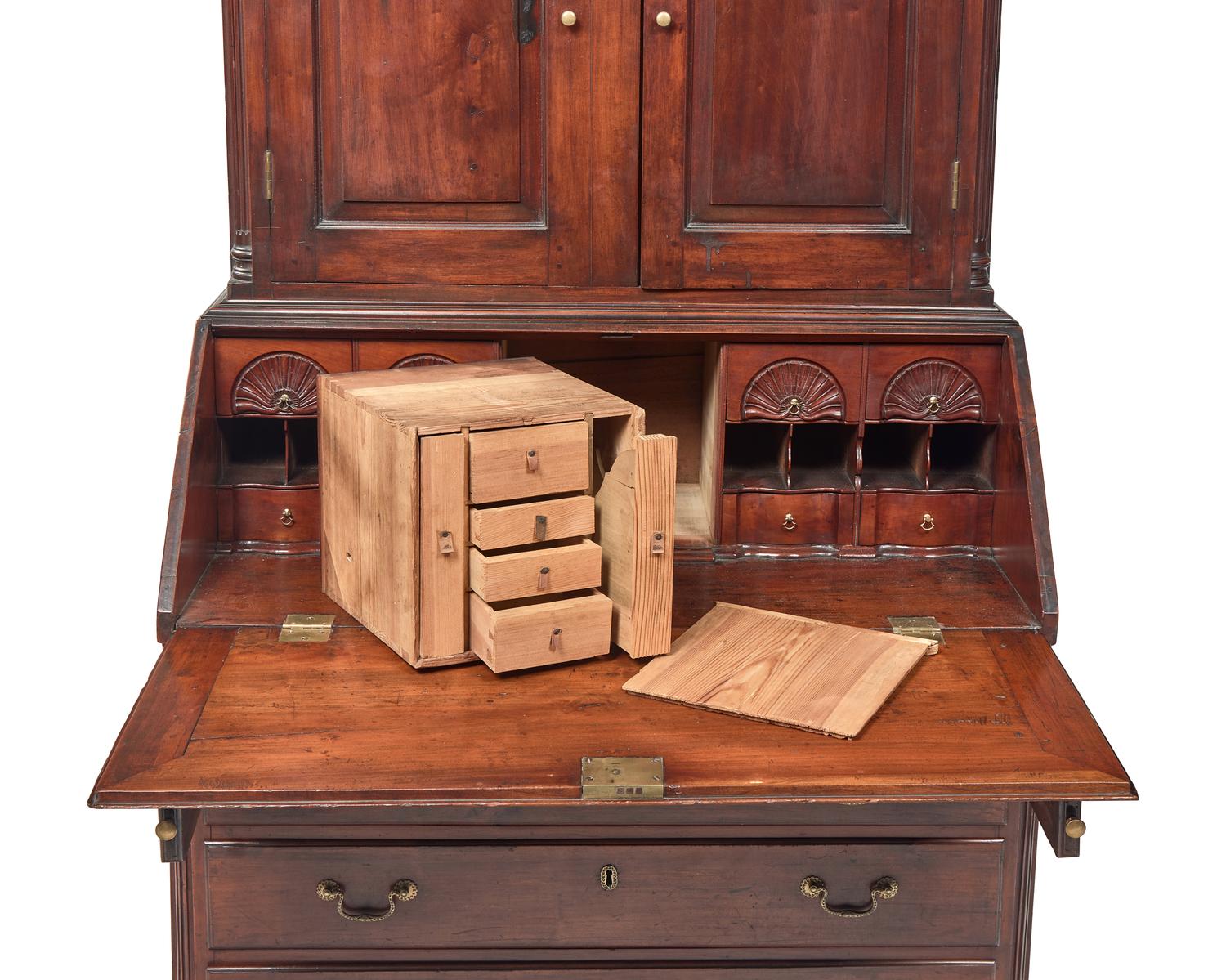 A Chippendale Carved Cherrywood Desk and Bookcase