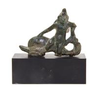 A Roman Bronze Eros Riding a Dolphin