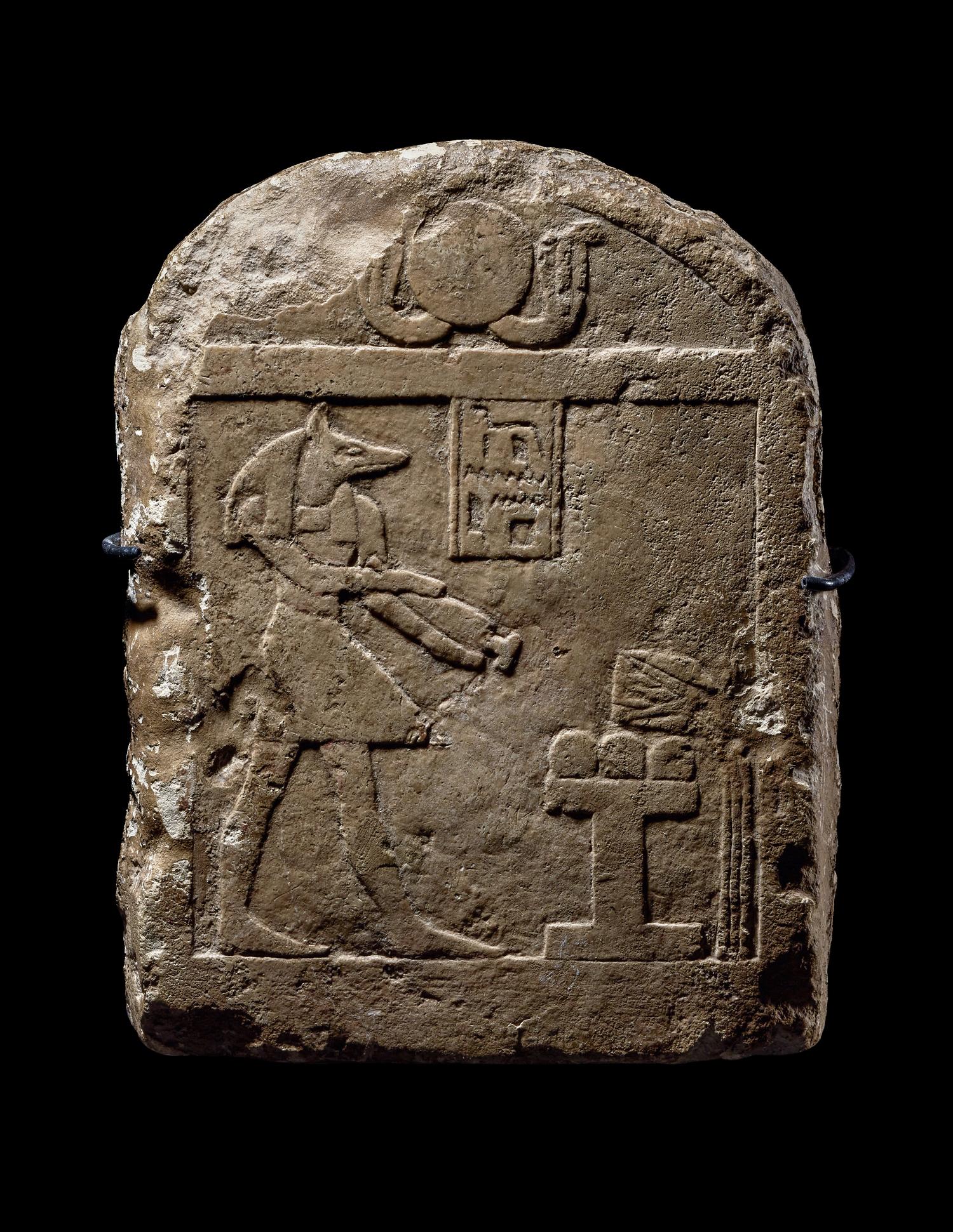 An Egyptian Limestone Round-Top Stele