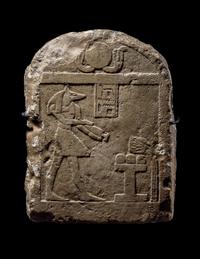 An Egyptian Limestone Round-Top Stele