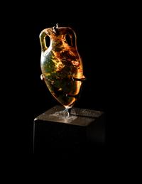 A Roman Natural Amber Amphoriskos Pendant